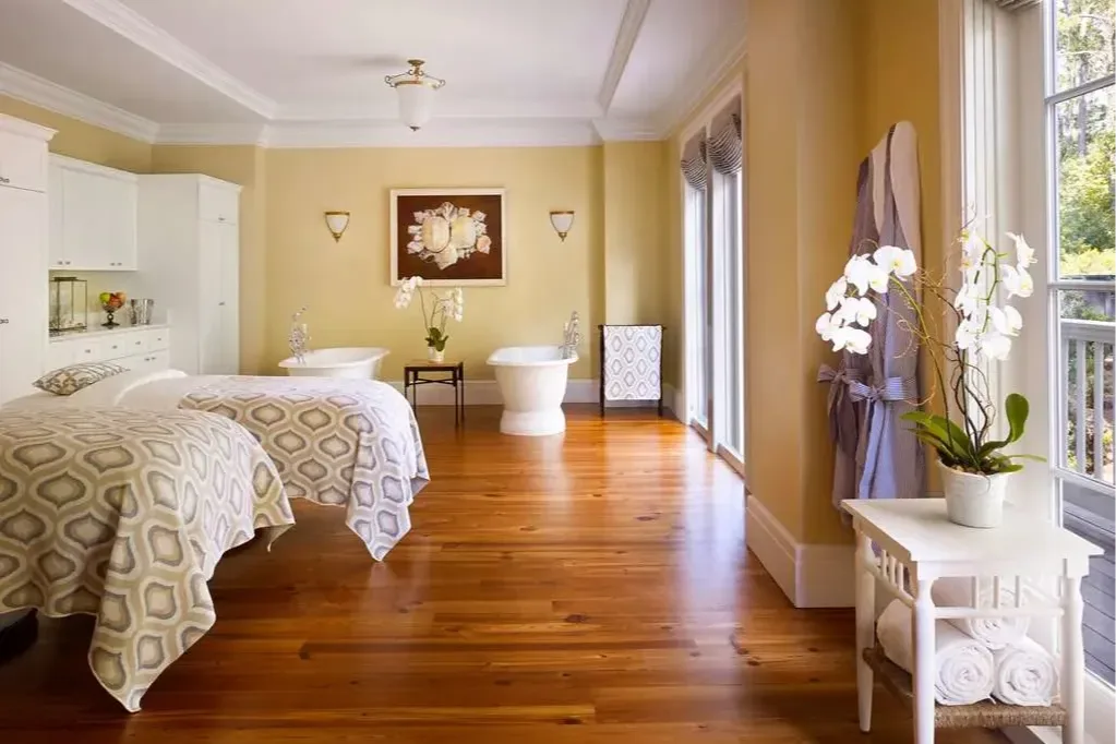 Hardwood floors, white orchids, porcelain soaking tubs, comfy-looking massage tables fill Montage Palmetto Bluff's spa