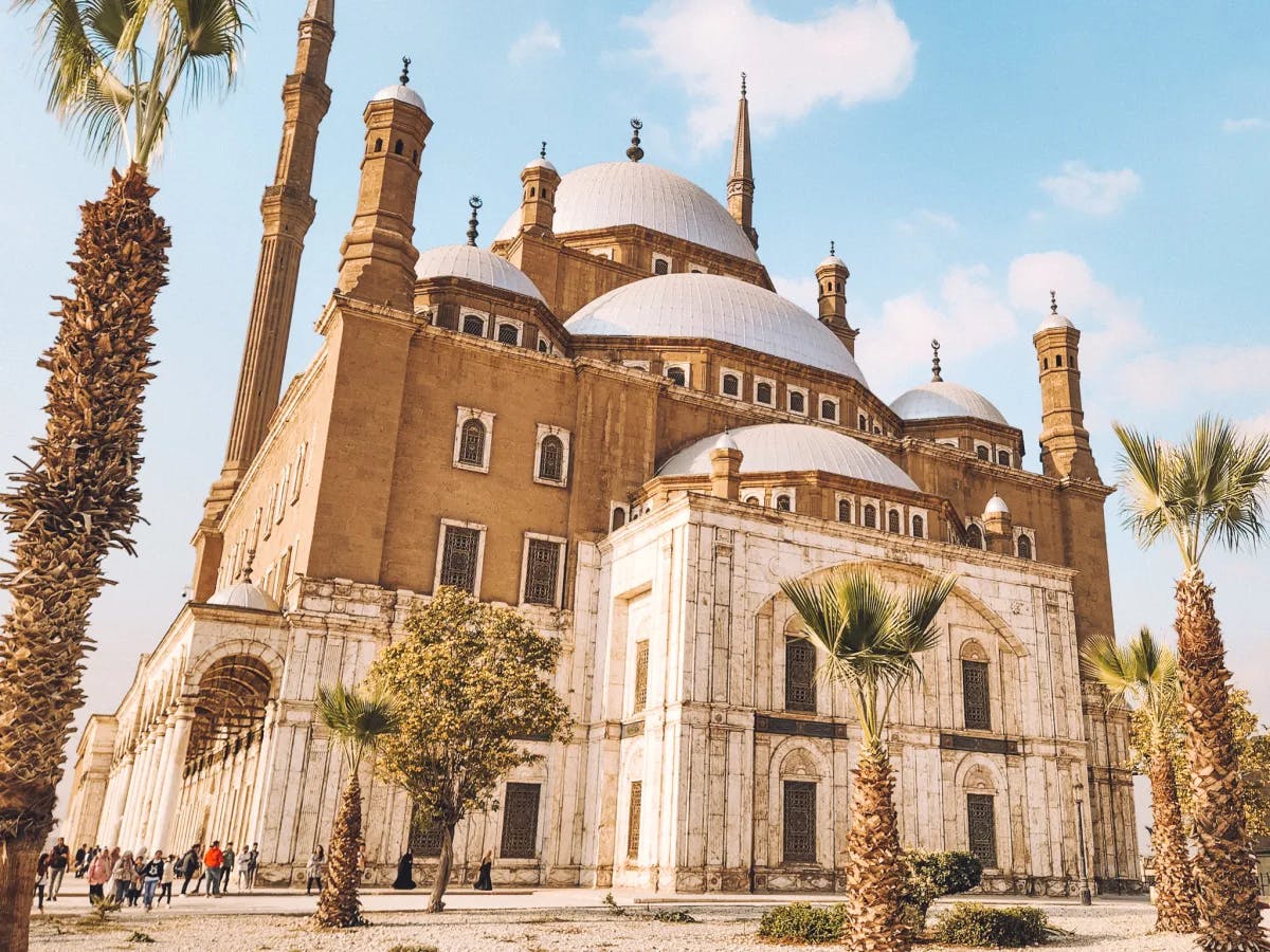 Muhammad Ali mosque – a large domed building with palm trees surrounding