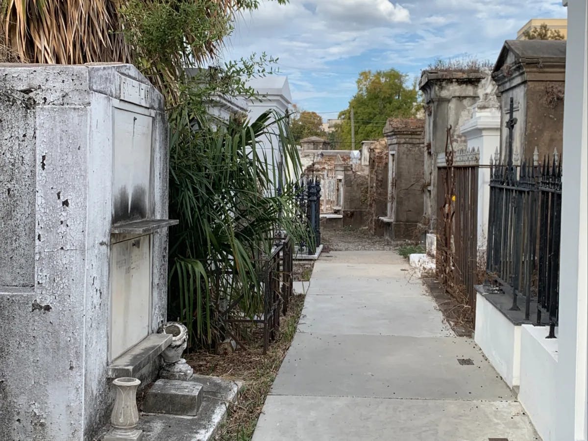 An old cemetery around a narrow pathway.