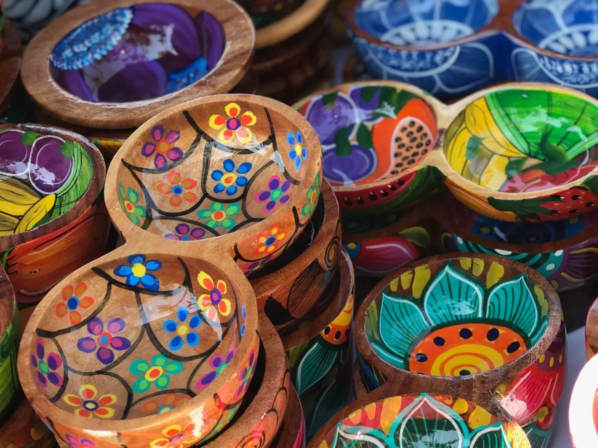 A stall of multi colored bowls. 