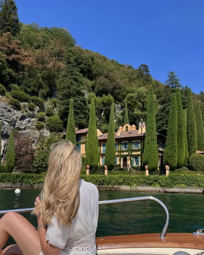 Advisor sitting on a boat on a lake in Italy on a sunny day