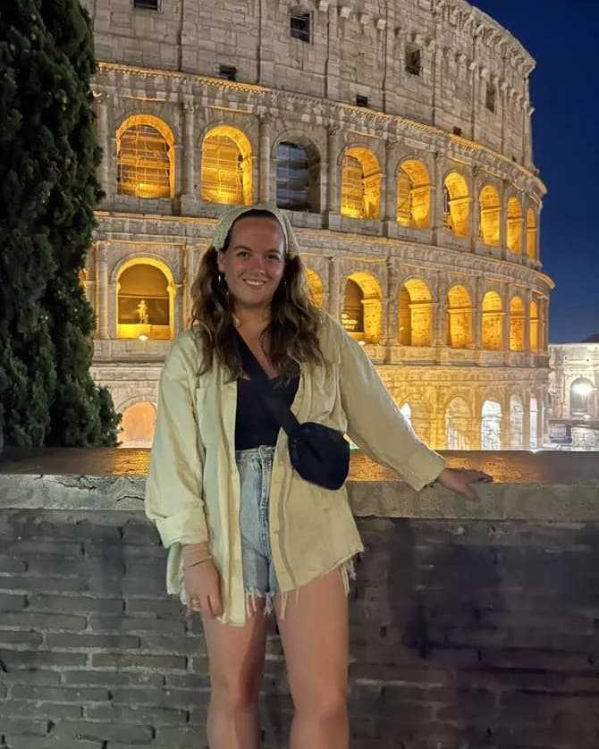 Woman in front of a beautiful building