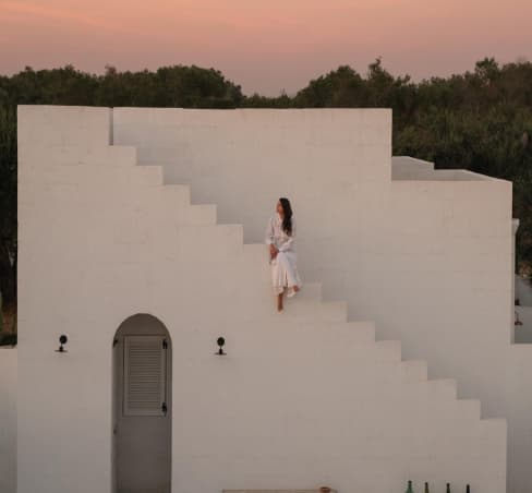 Woman sitting on holiday home in Italy, Borgo Gallana