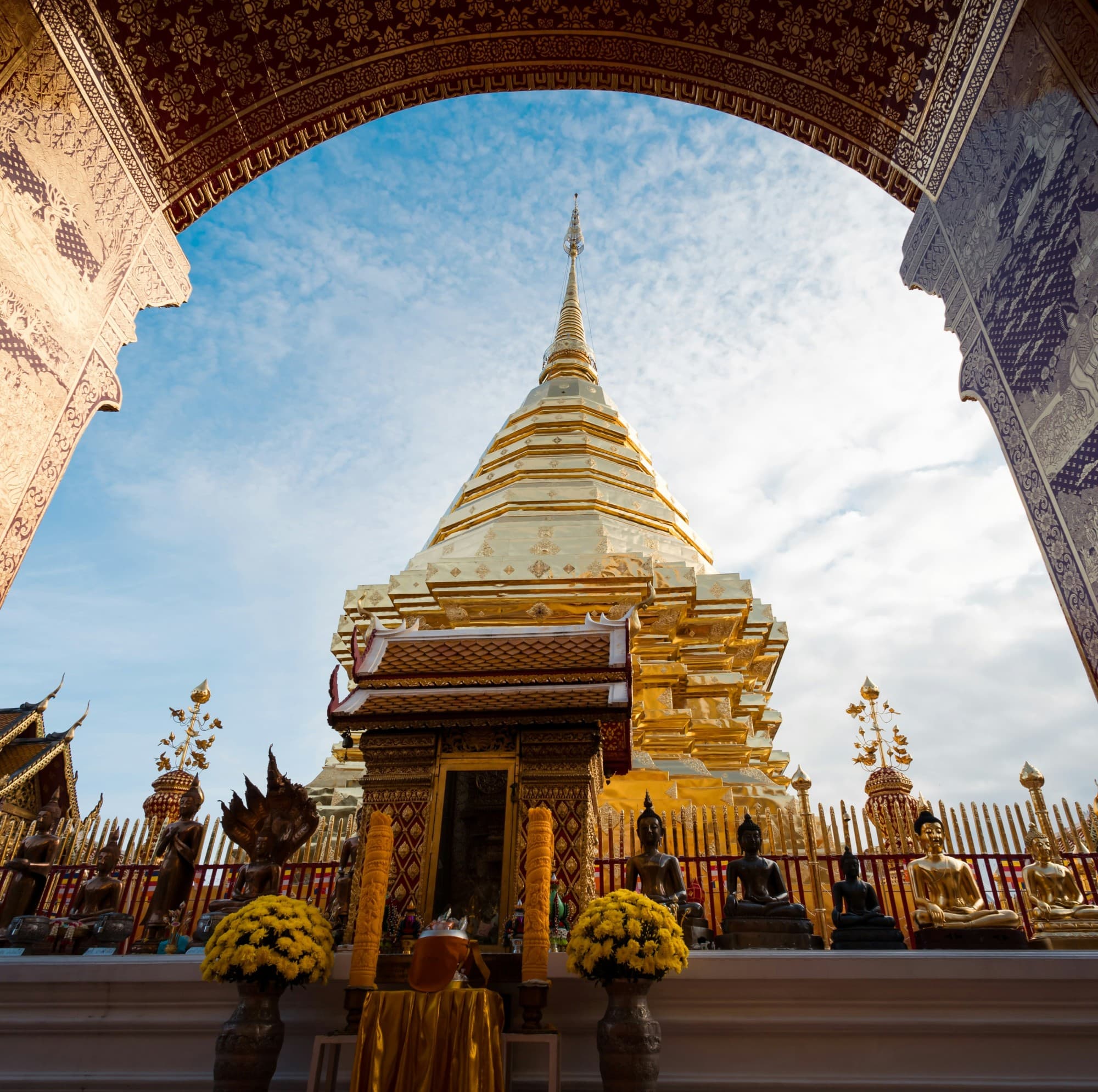 The outside of a temple building against a blue sky