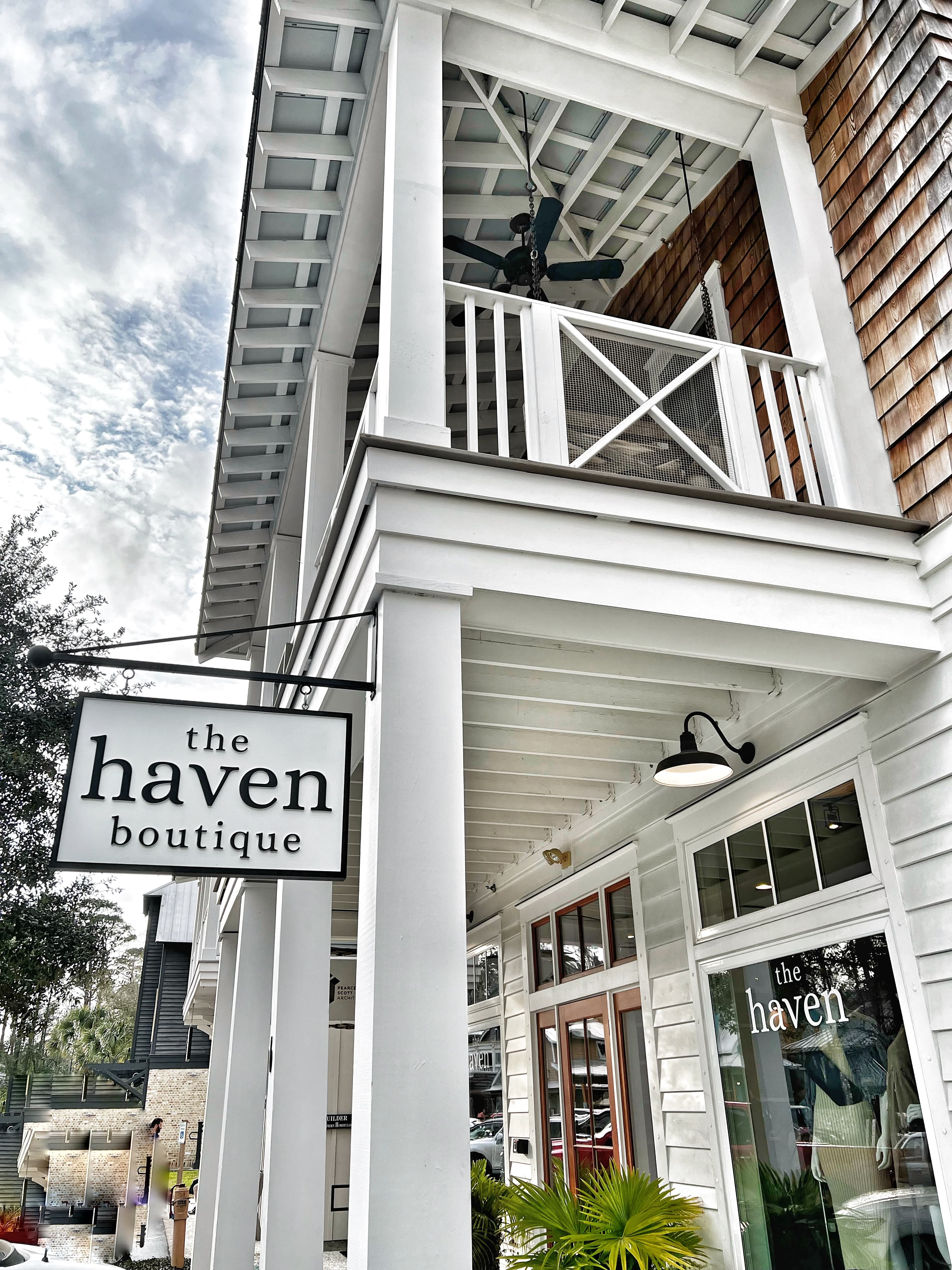 A shop with a shiplap exterior and a sign that reads "The Haven."