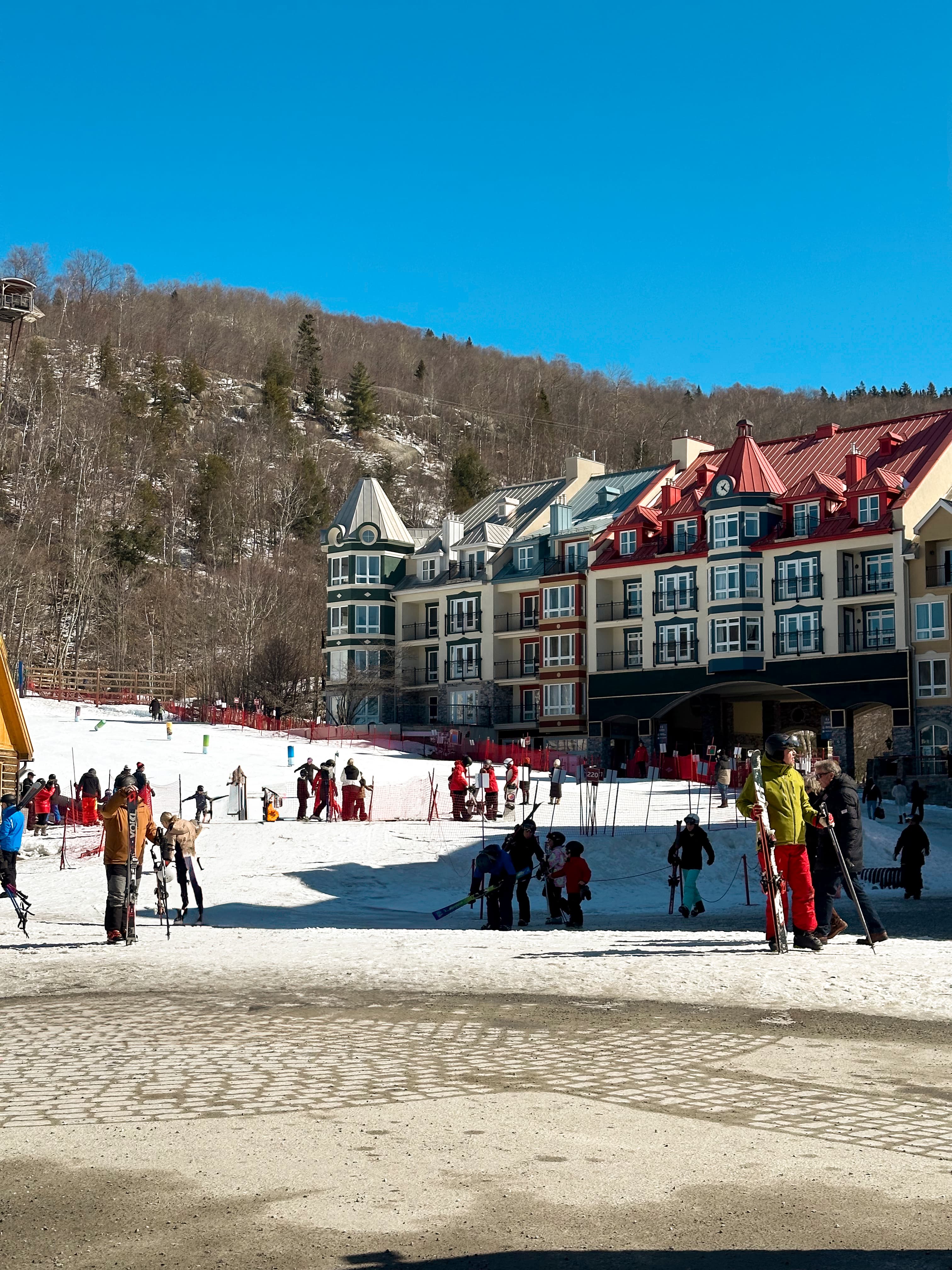 People skiing on a snow-covered slope during the daytime