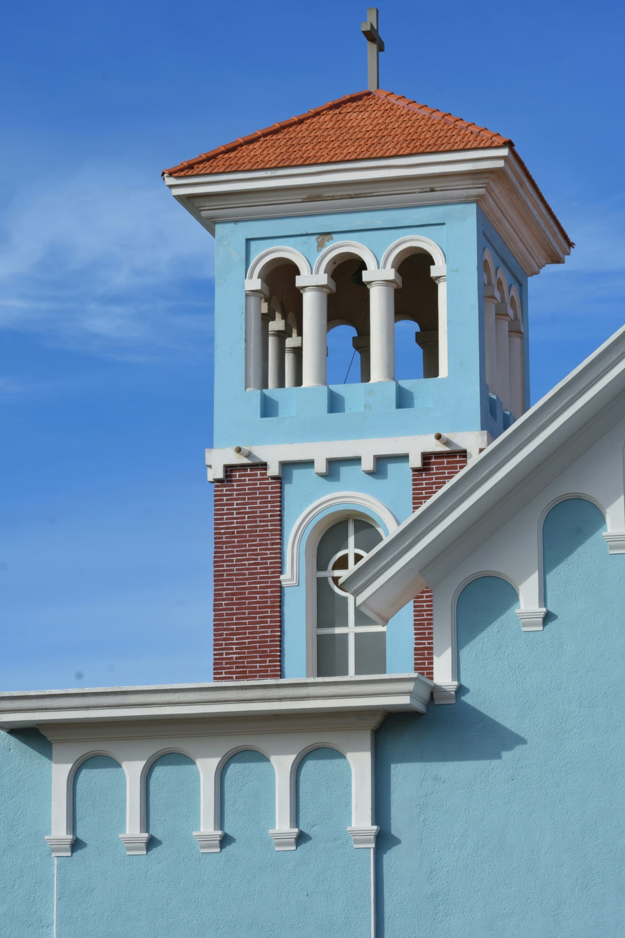 A light blue and brown building.