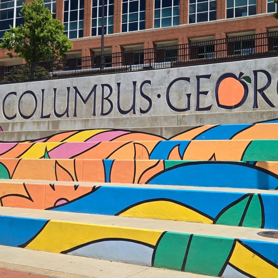 Colorful stairs with Columbus Georgia written on back.