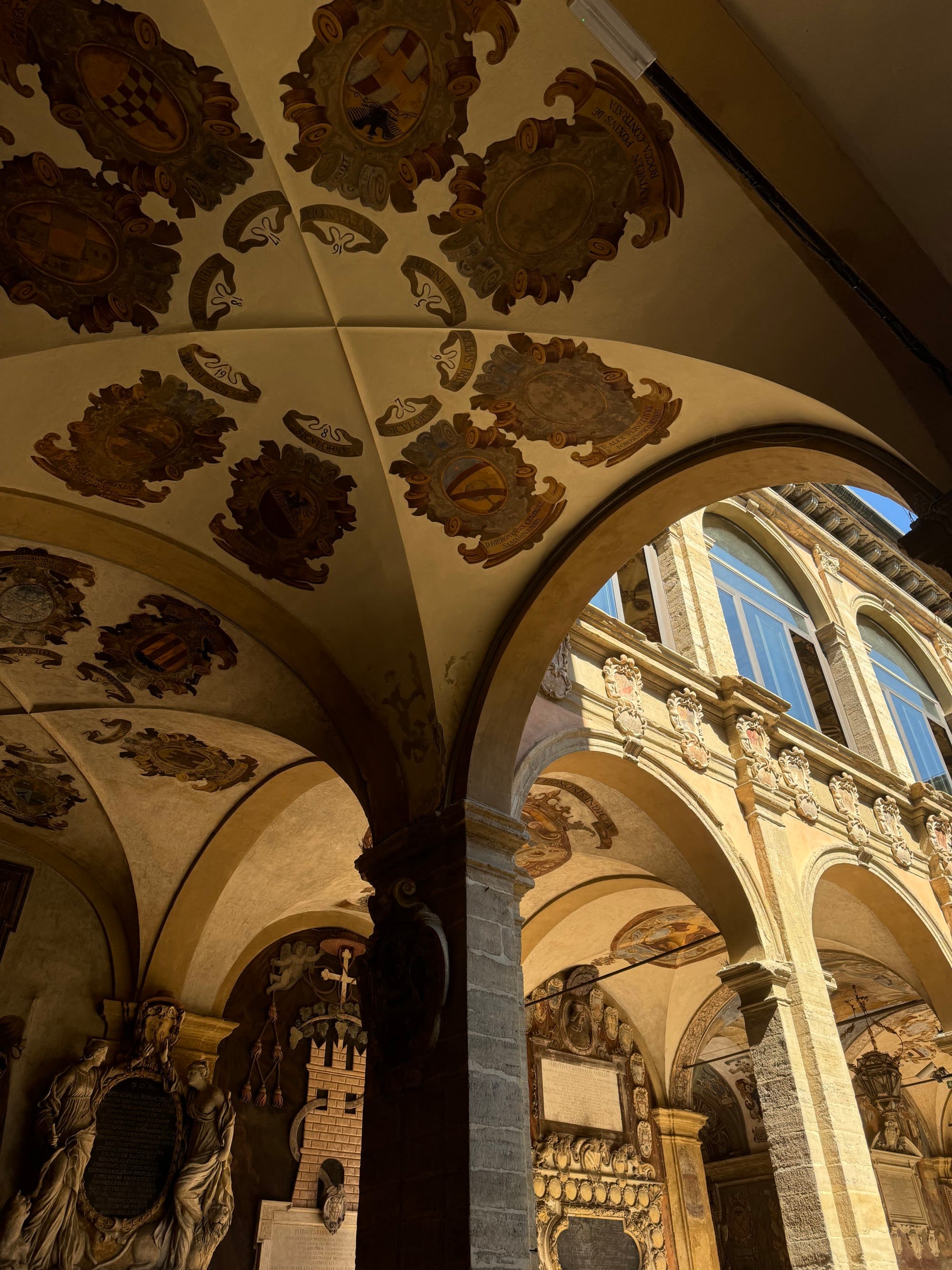 An ornate spiral staircase with intricate patterns viewed from below, creating a mesmerizing architectural perspective.