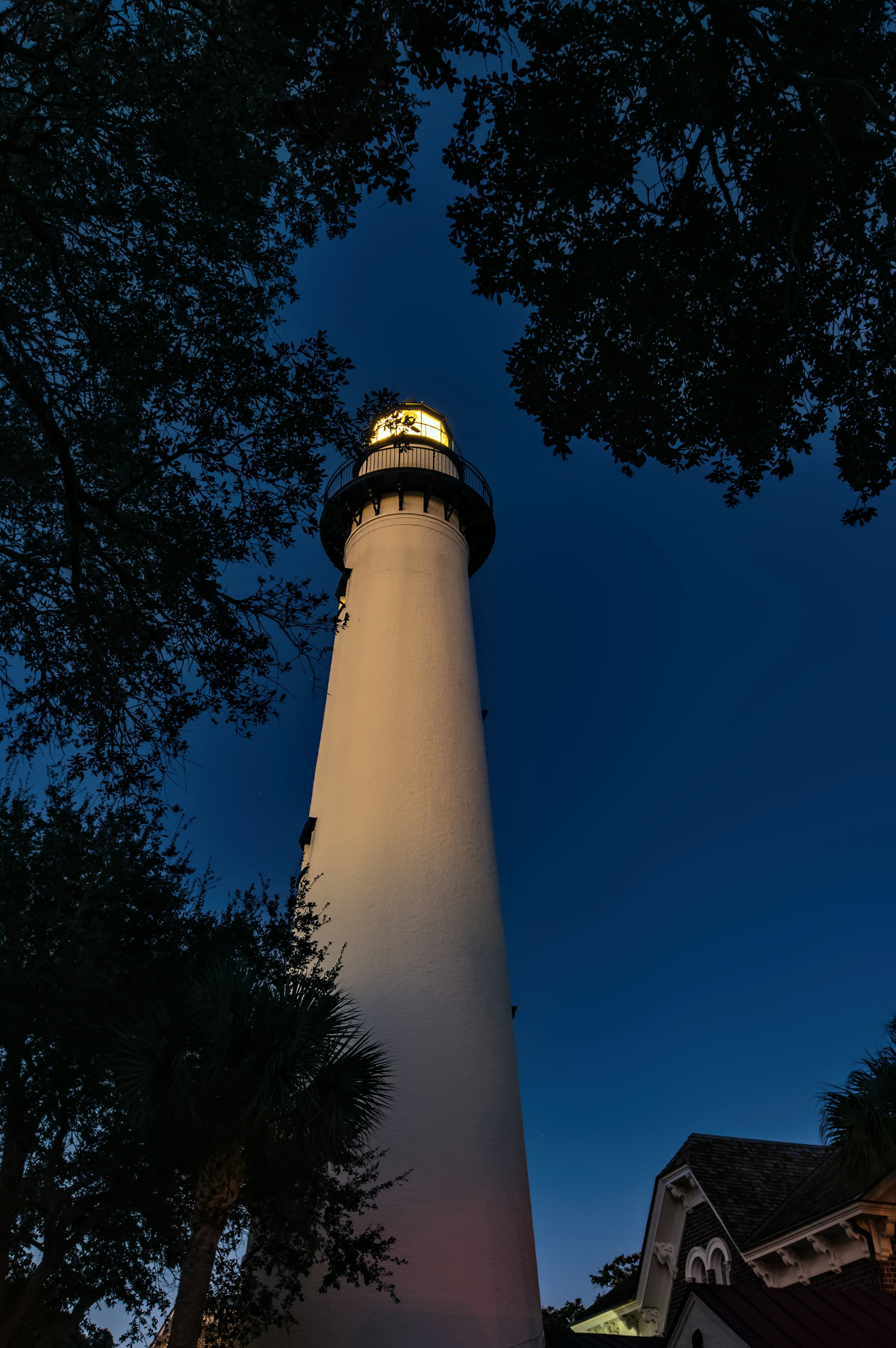 A low-angled view of a lighthouse at nighttime