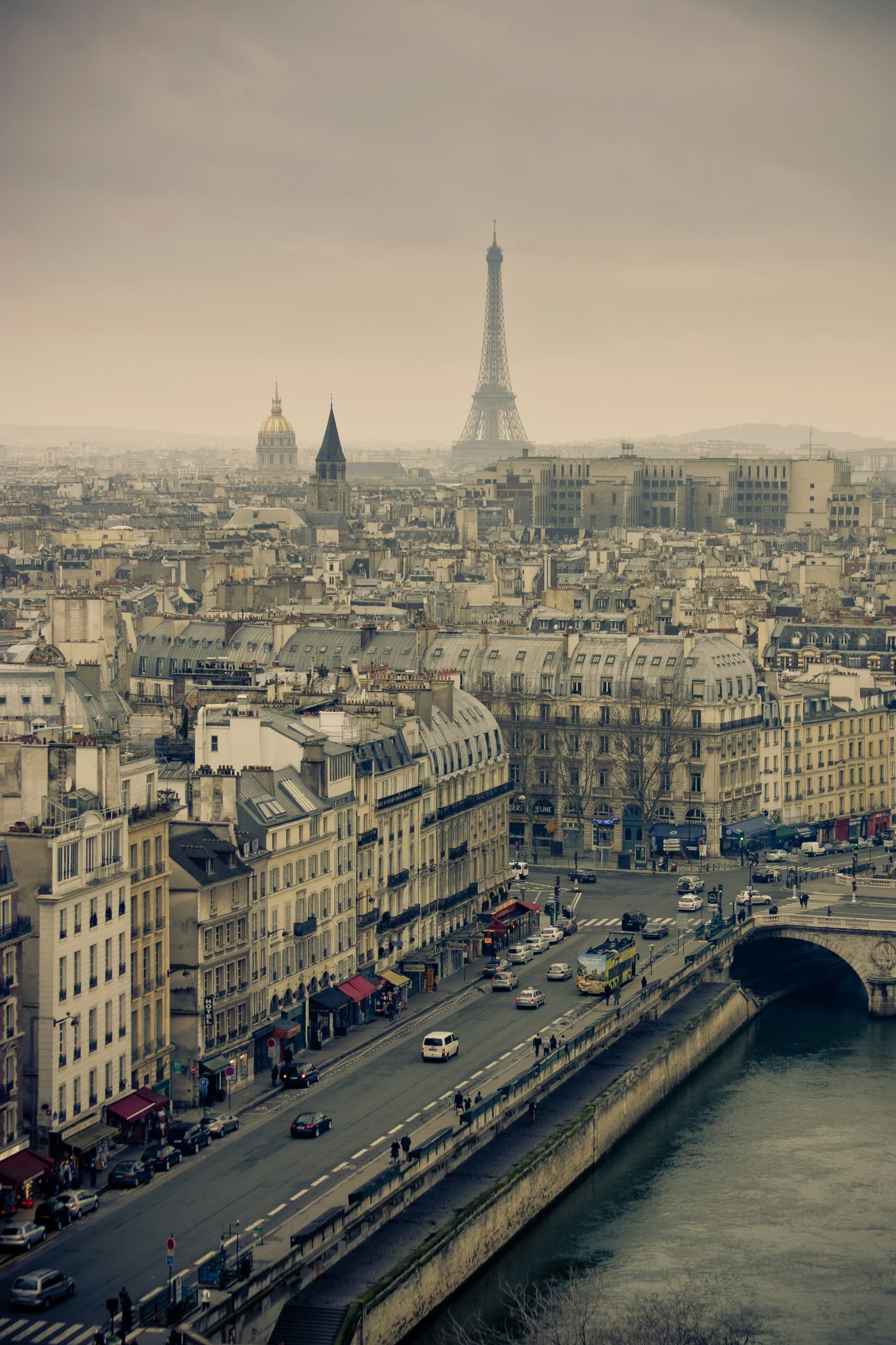 Skyline of Paris with Eiffel tower on a misty day.