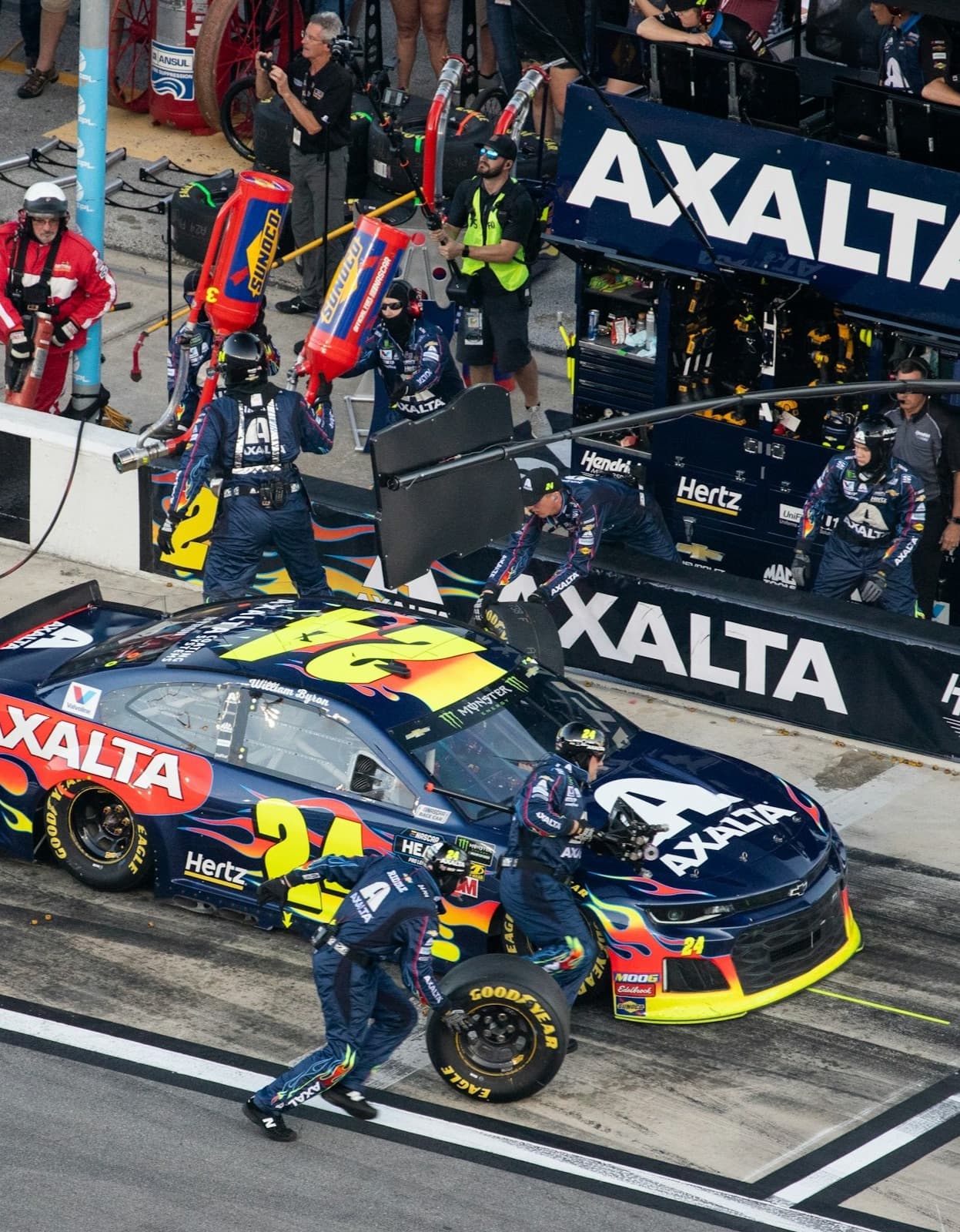 A racecar makes a pit stop on a race track.