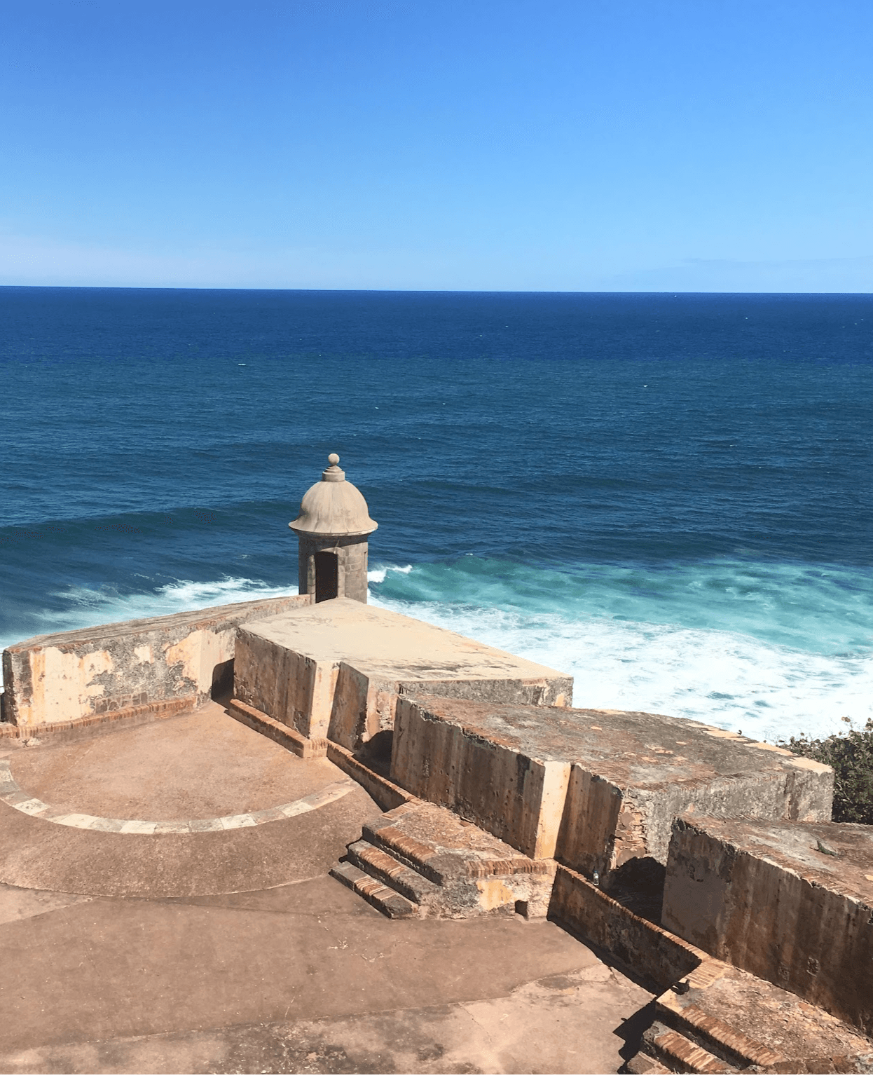 The historic fortress in San Juan, Puerto Rico, overlooking the Atlantic Ocean on a sunny day.