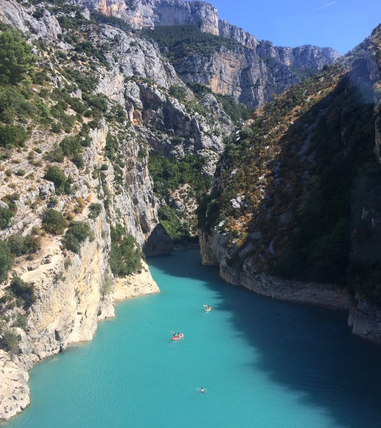 A body of water between two rocky cliffs during the daytime