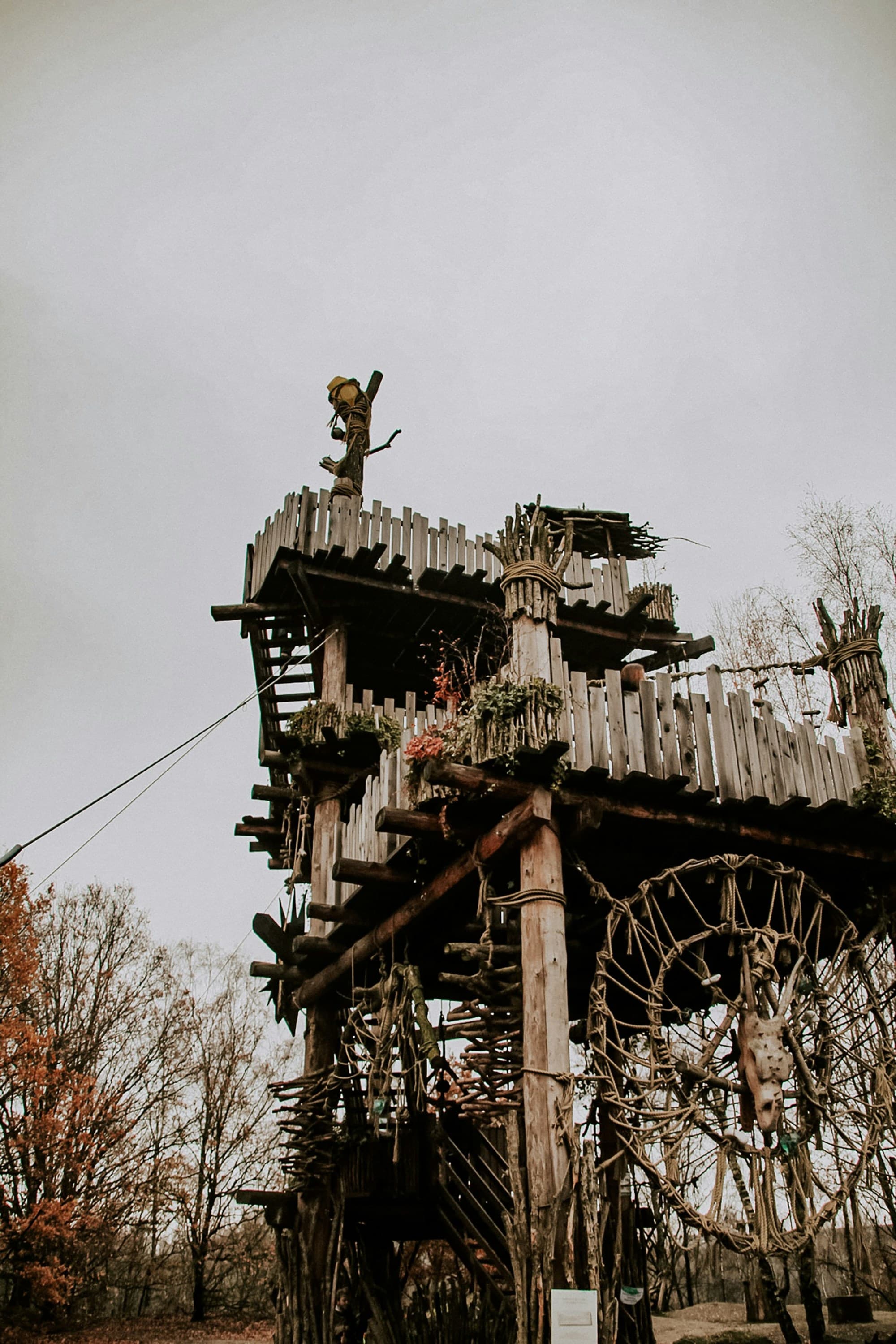 Brown wooden tower with cross on top