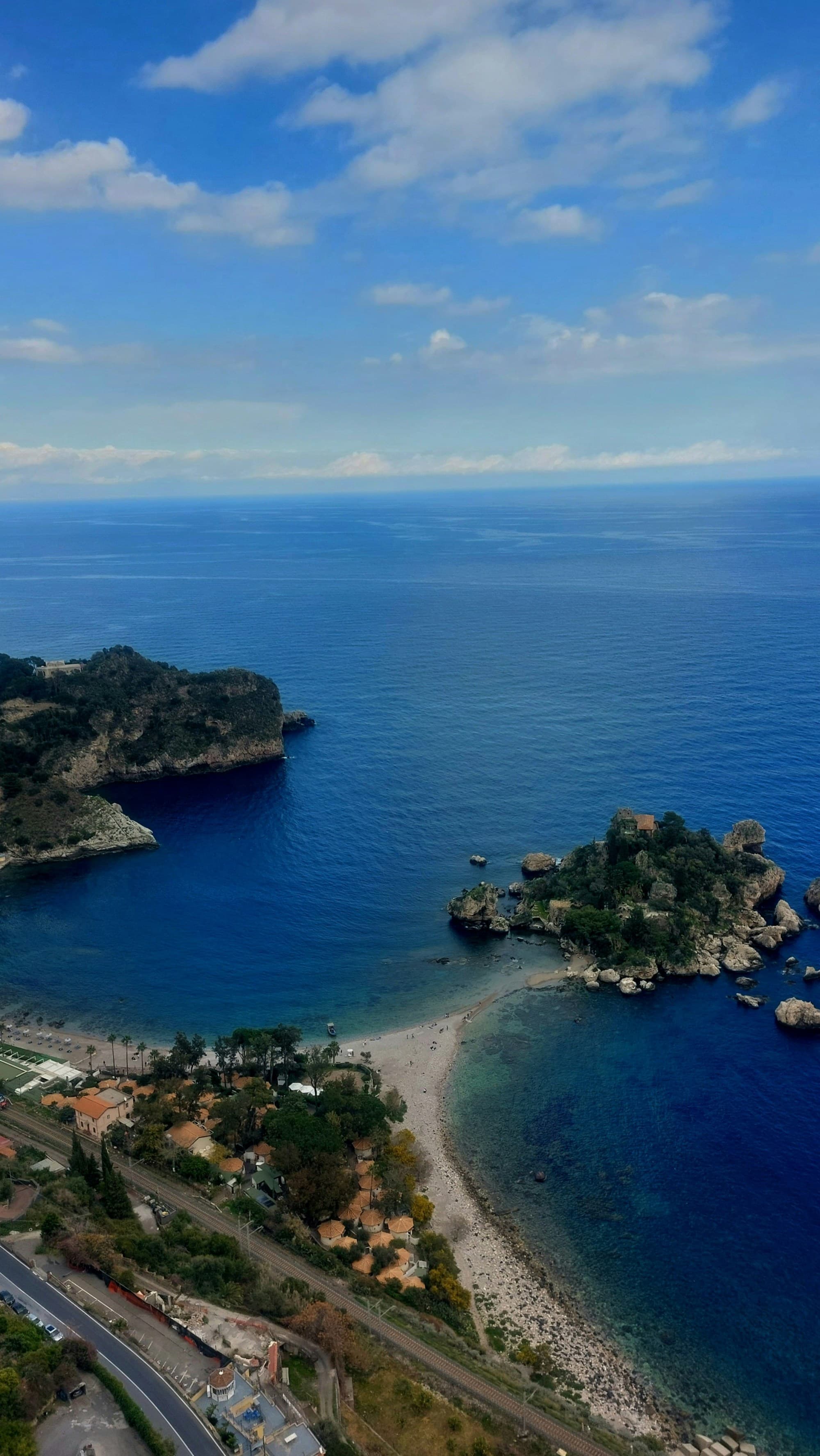 Aerial view of ocean and its shore.