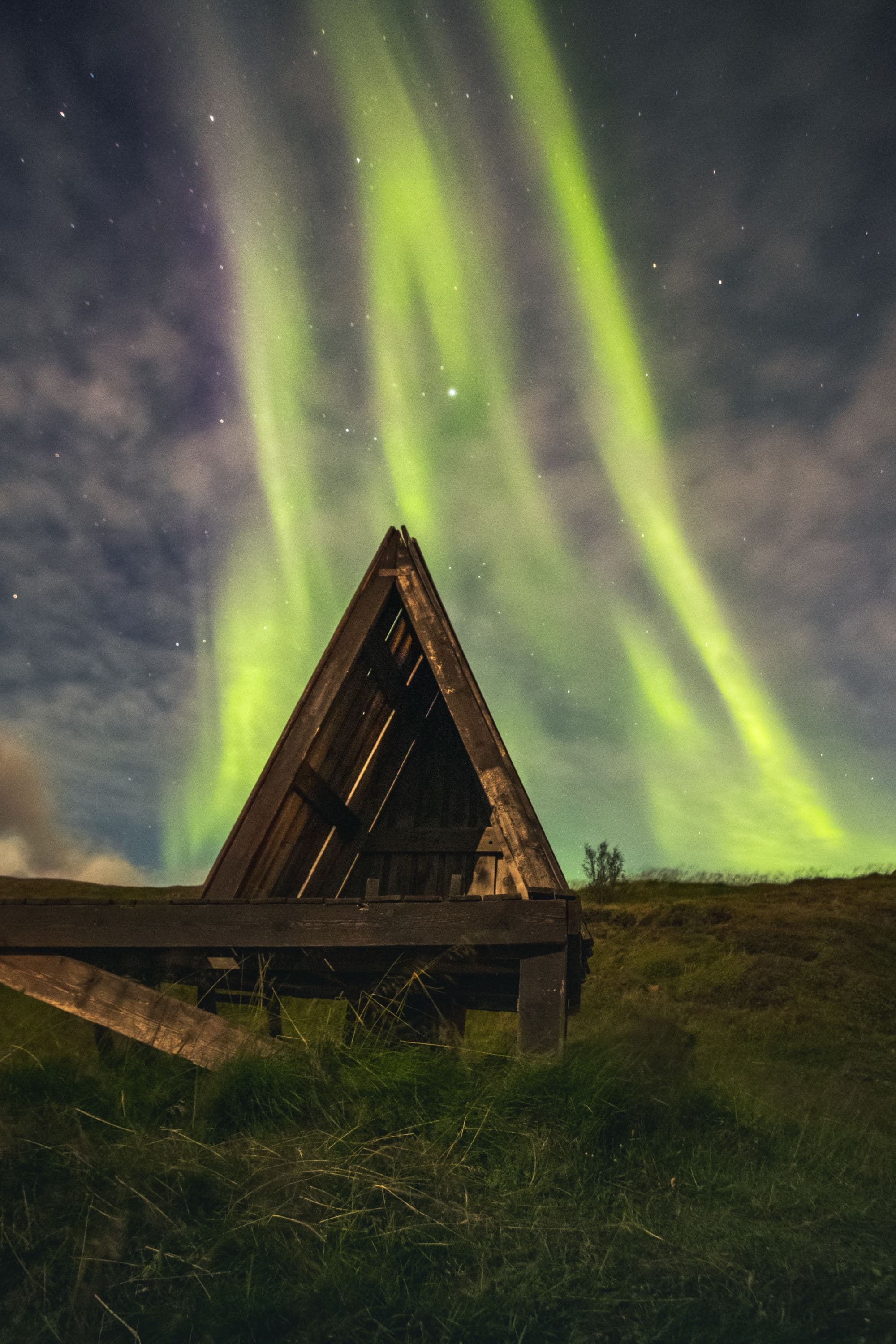 Green lights in sky during night time.