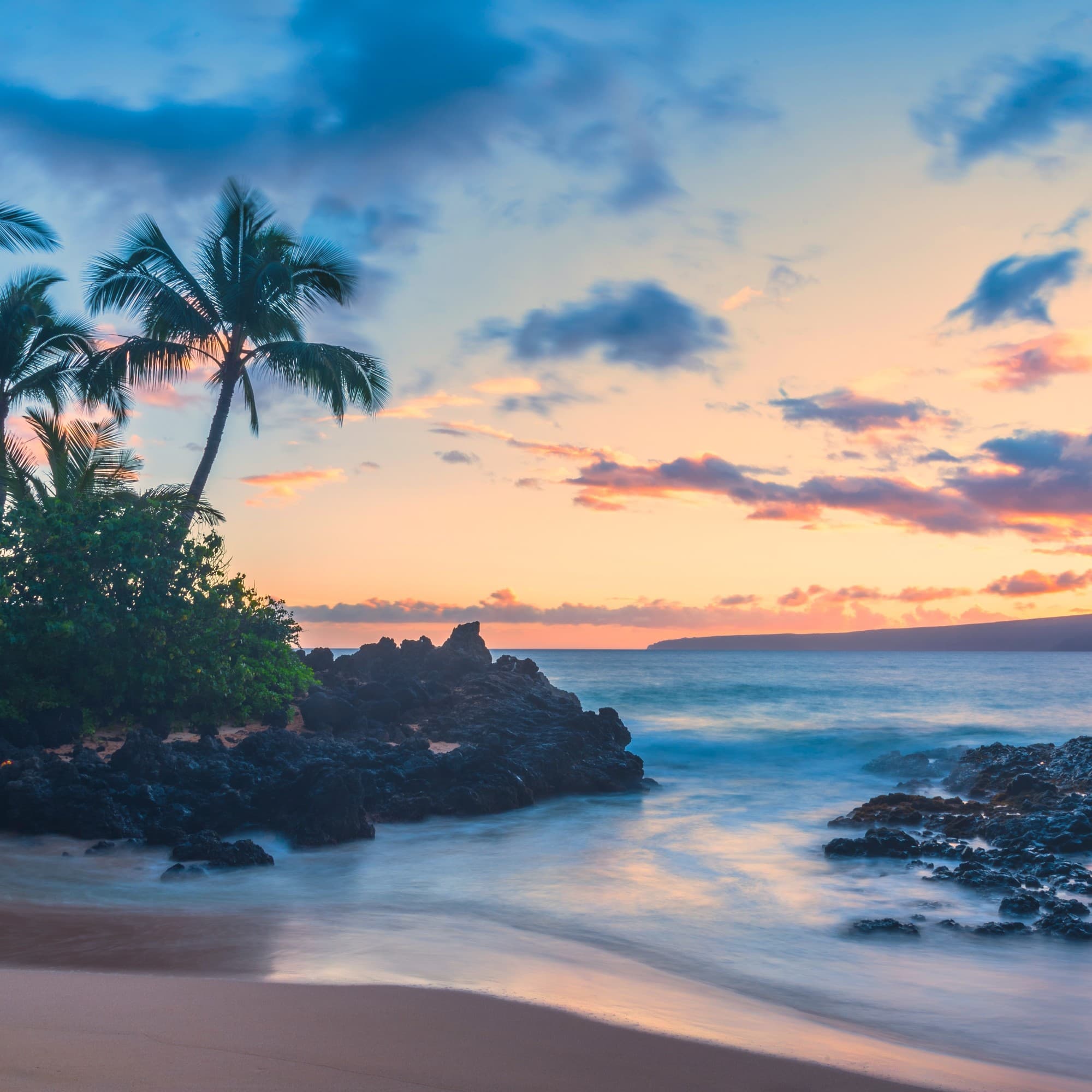 Beach view with blue colored water and skies.