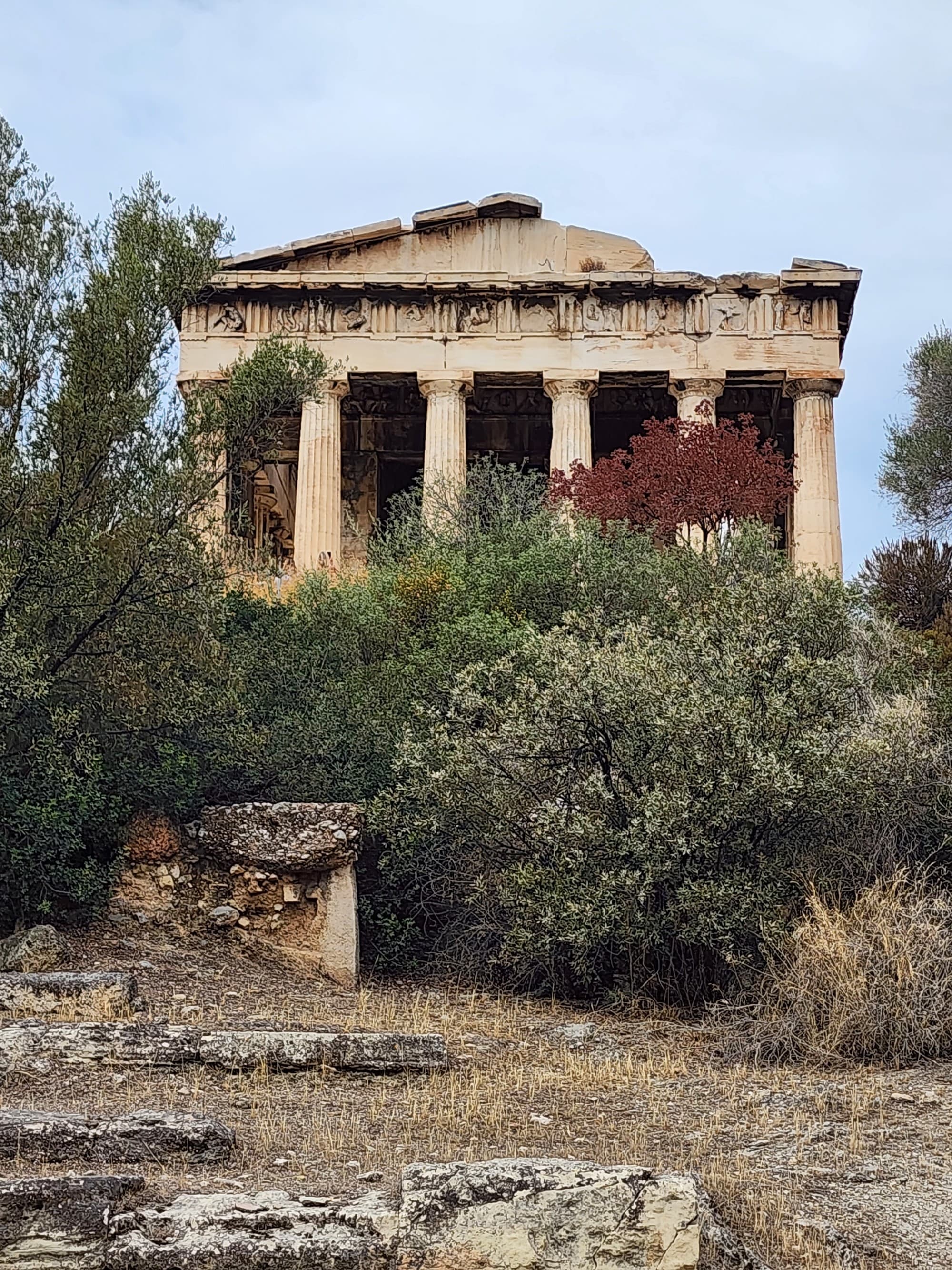 A picture of relics of an ancient building with pillars during daytime.