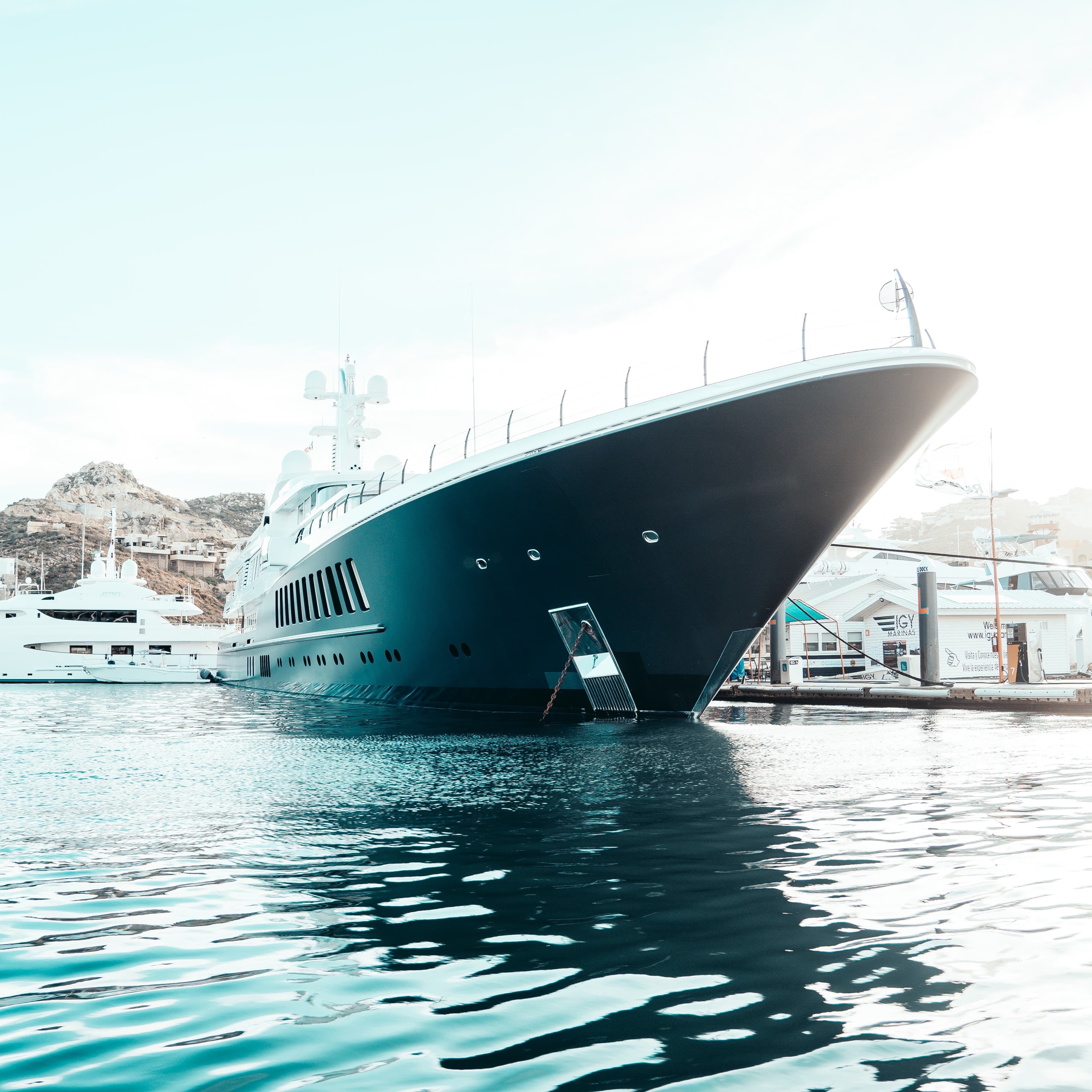 A ship anchored near the dock in daytime.