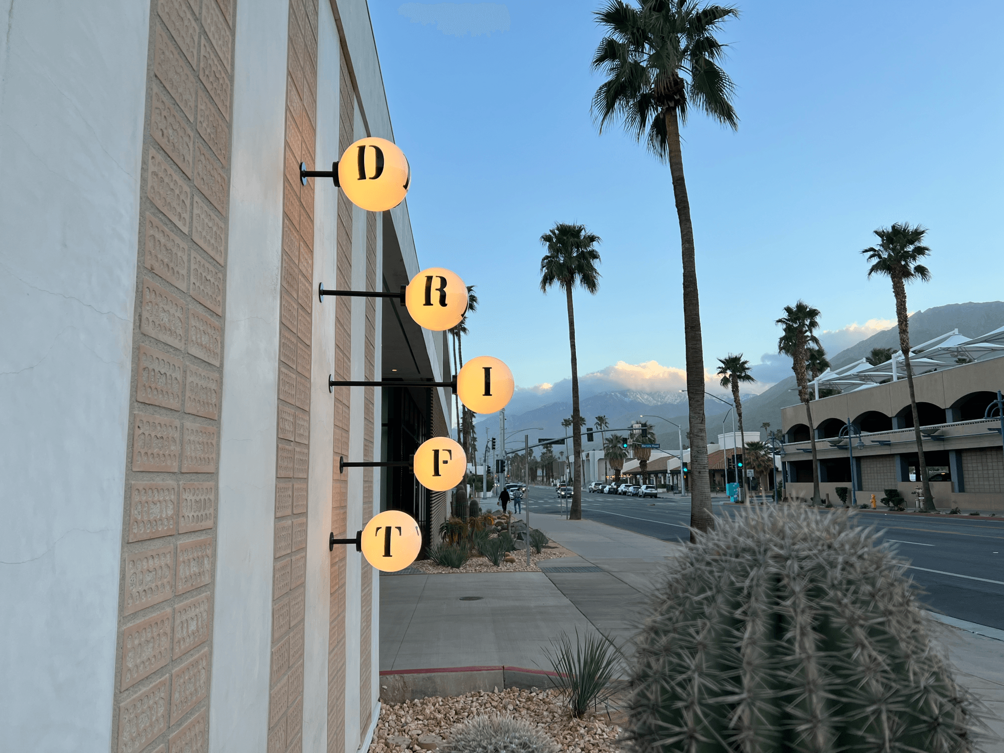 illuminated bulbs with letters on them that spell "Drift"