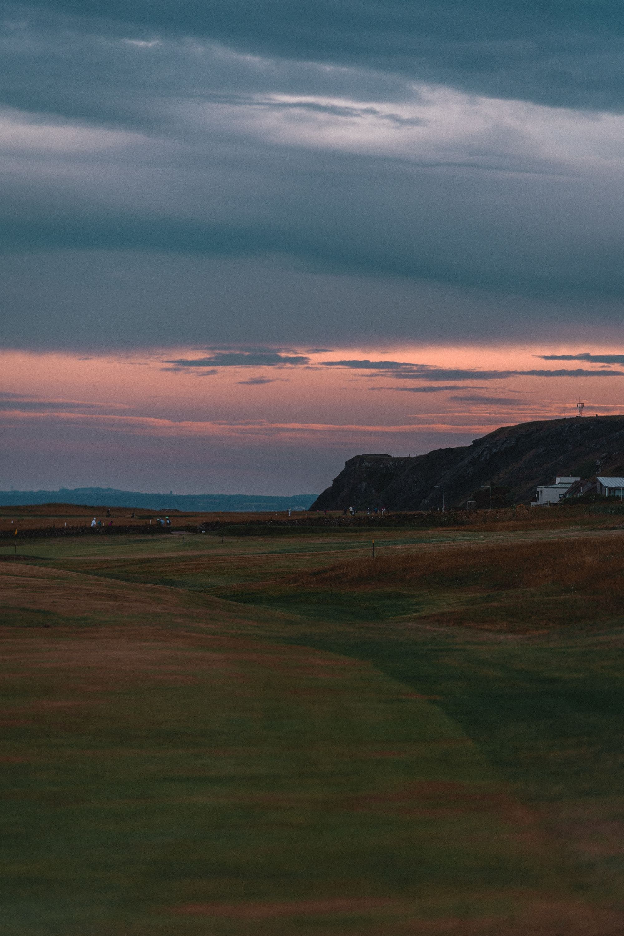 golf course on coast at pink sunset