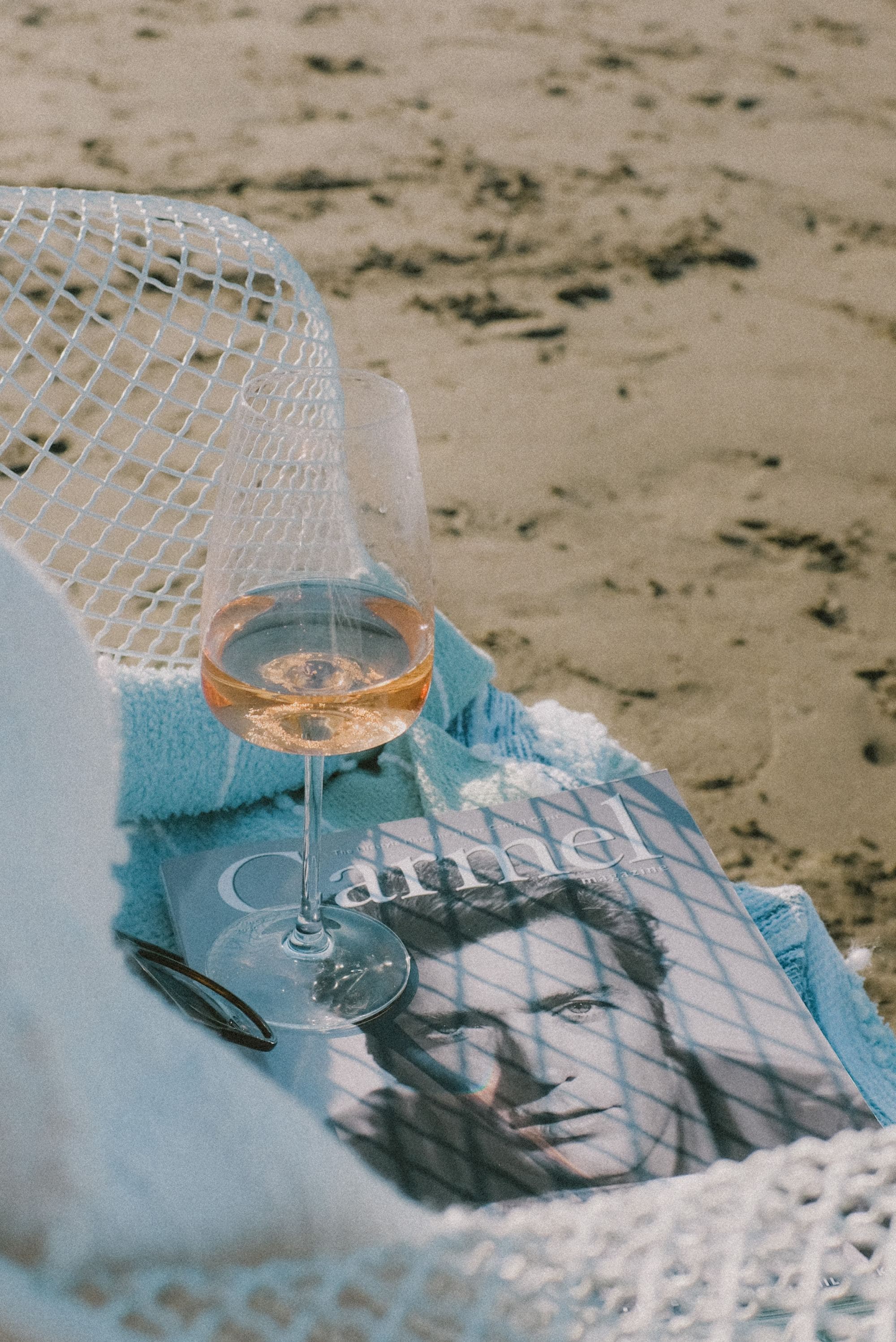 A magazine cover and a glass of champagne.