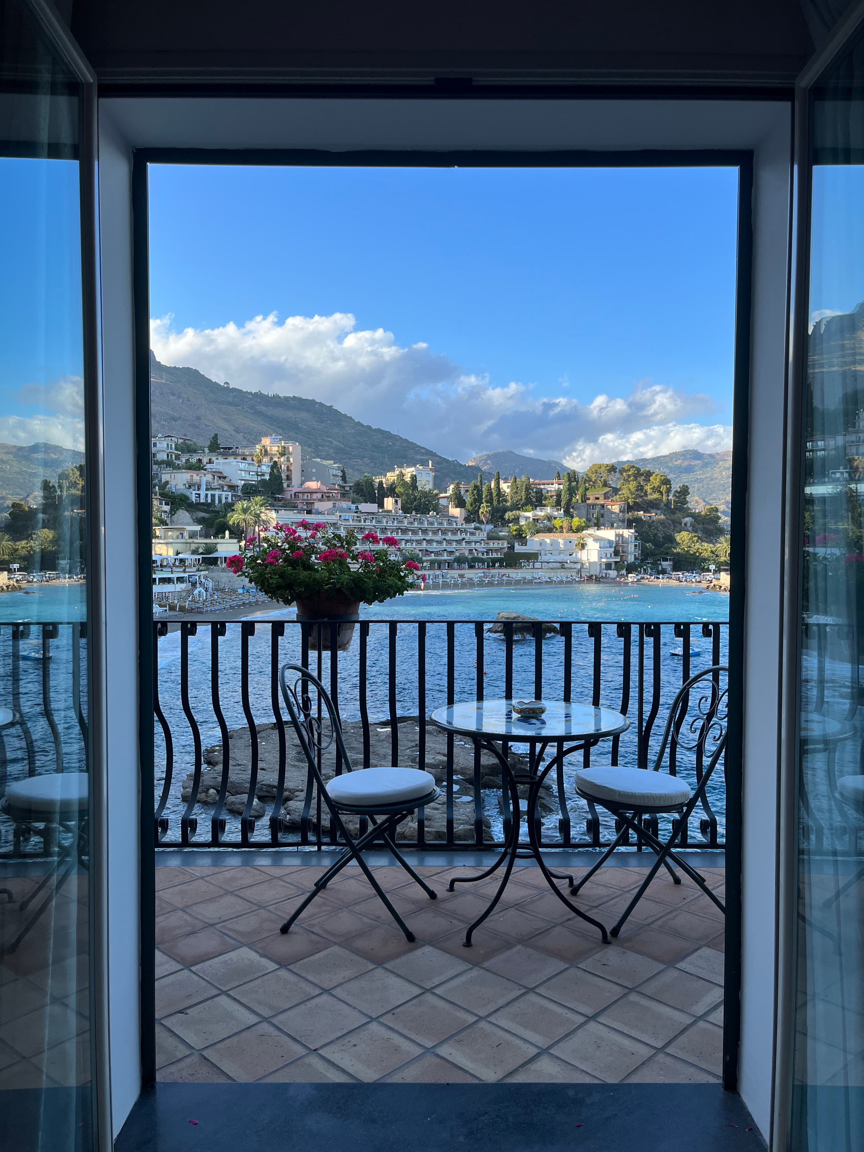 Balcony of a hotel looking out on a body of water