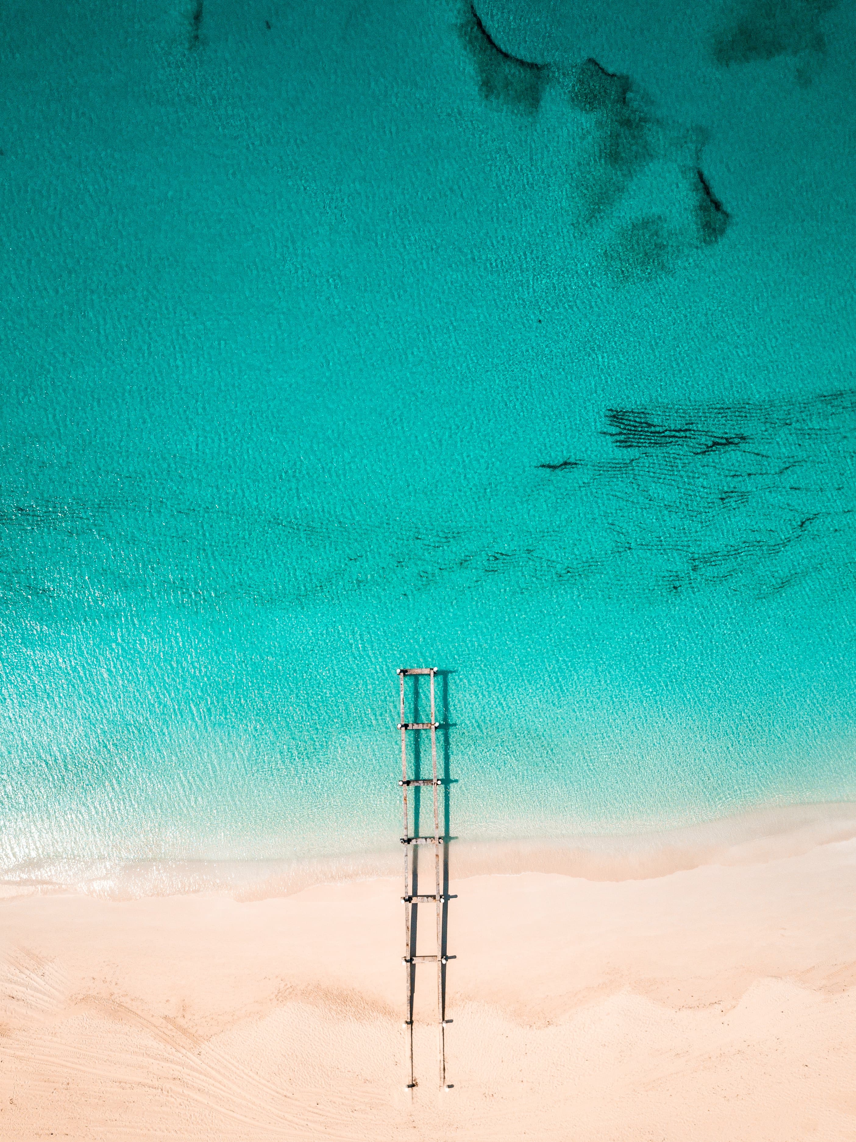 An azure blue sea and white-sand beach.