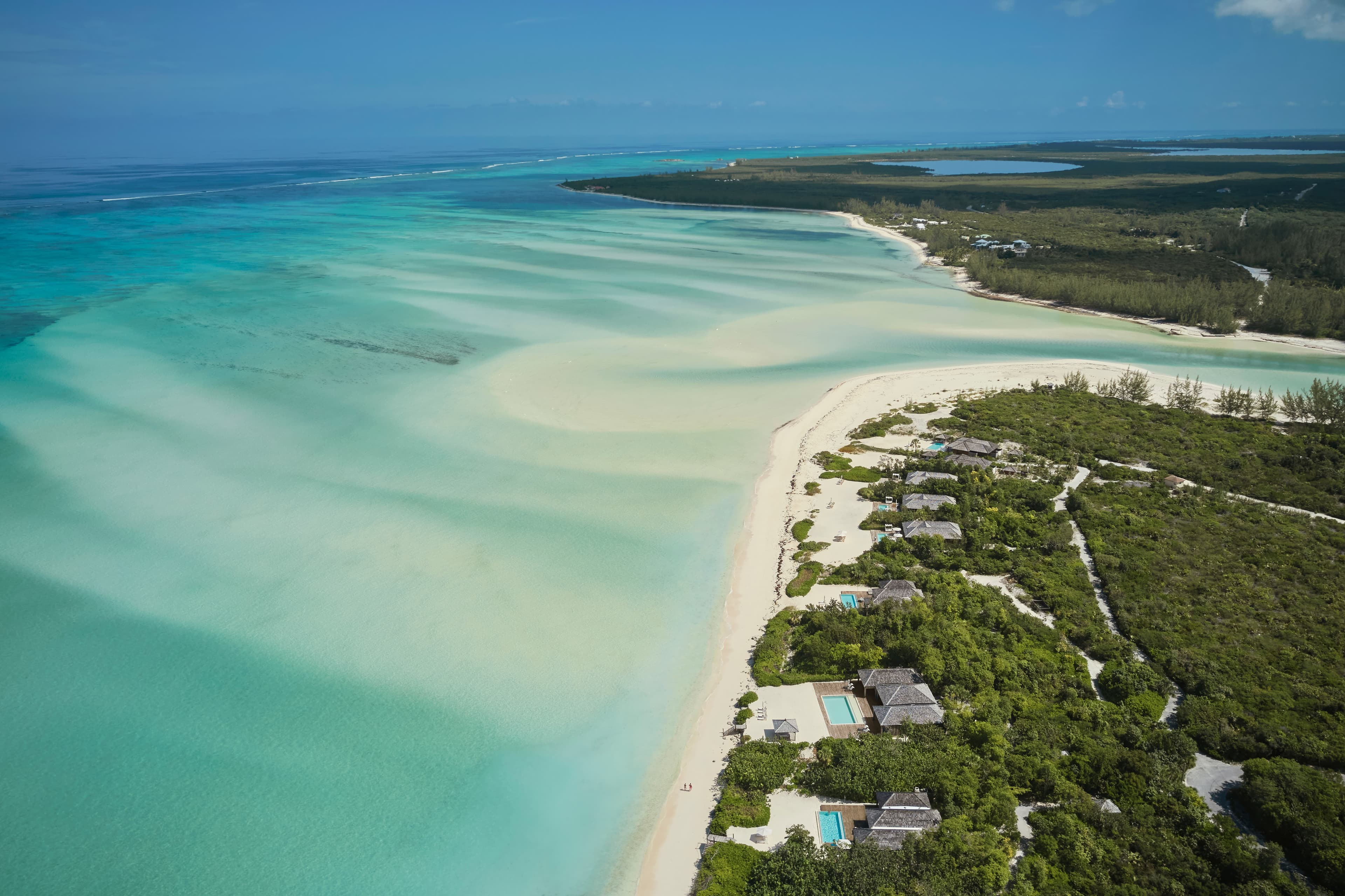 aerial view of white sand and coastline during daytime