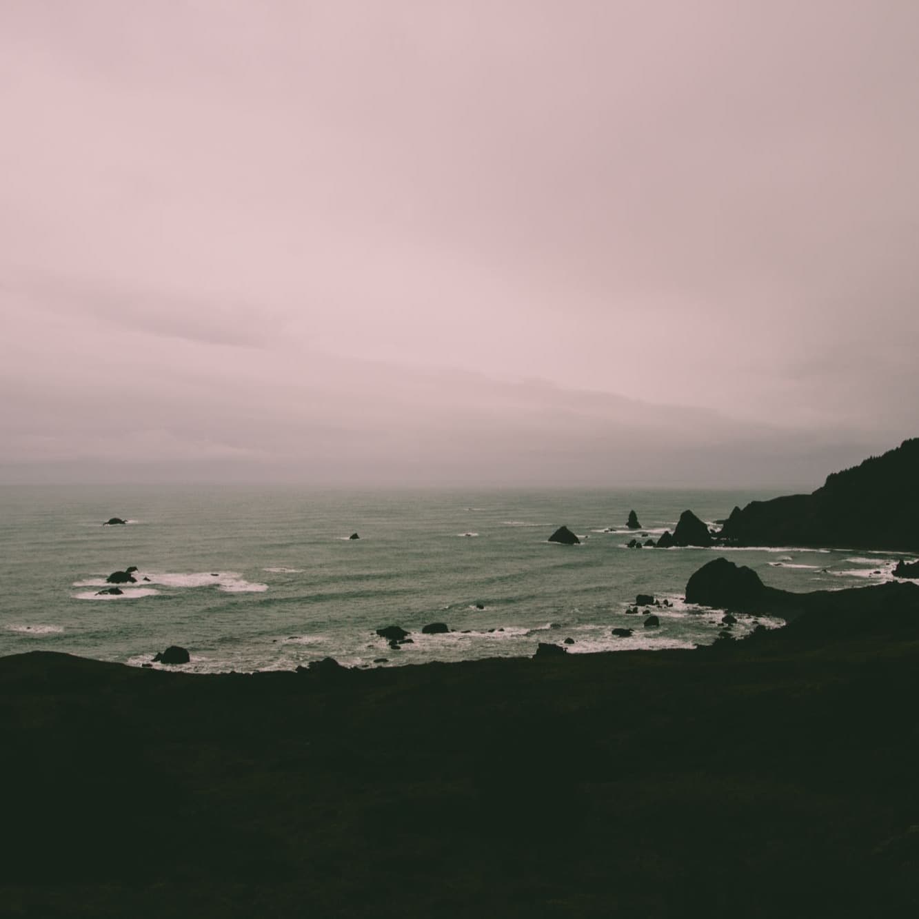 Black and white photo of a beach.