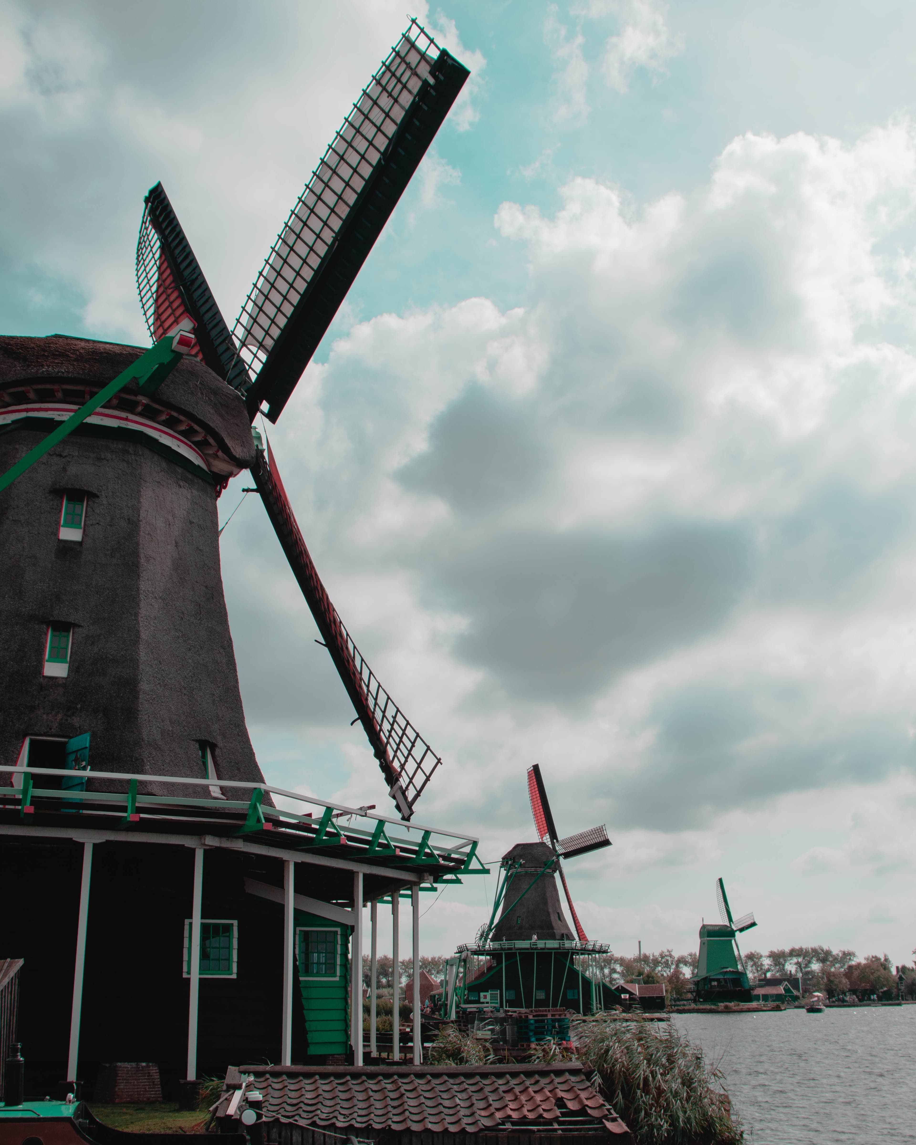 Windmills beside body of water in Netherlands