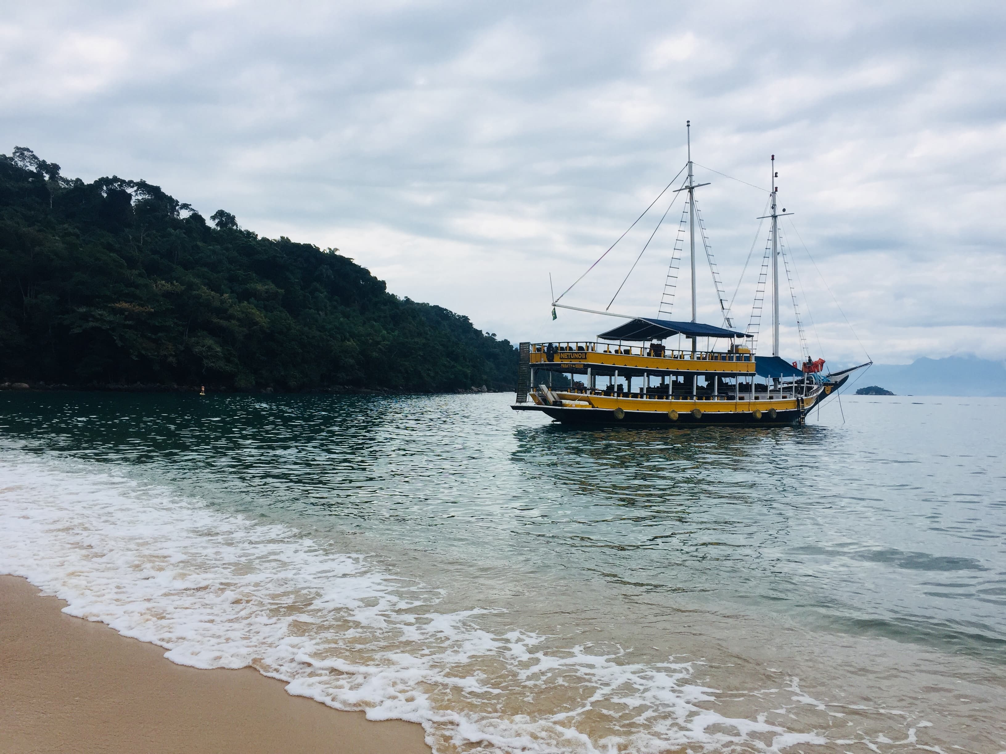 A boat in the middle of sea.