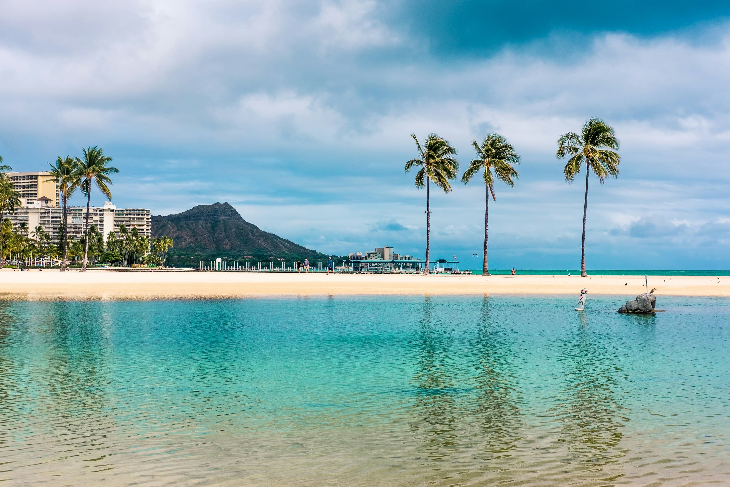 Beach view with a mountain in the distance during daytime