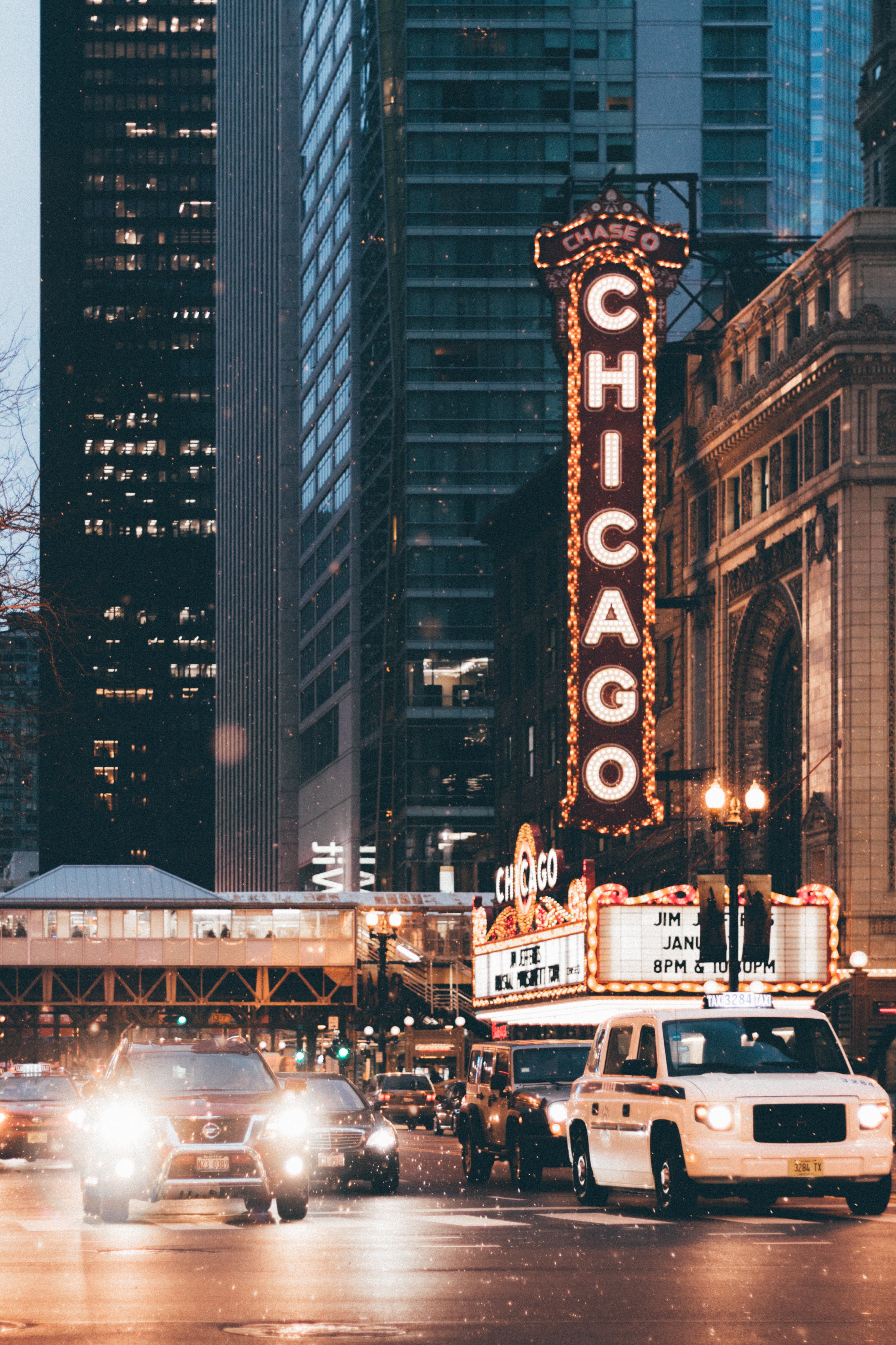 building with large chicago sign next to busy street