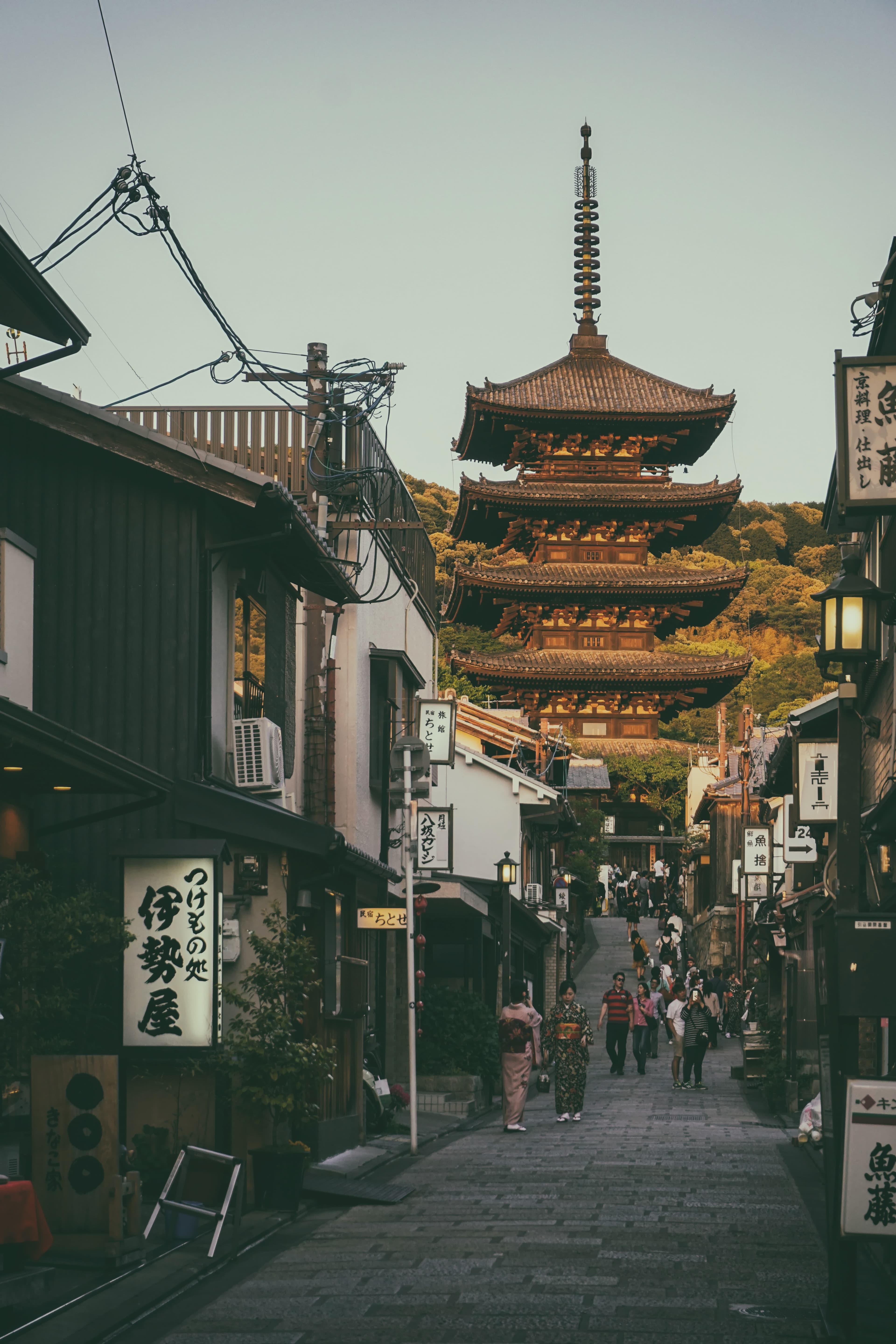 street lined with buildings with temple in the background