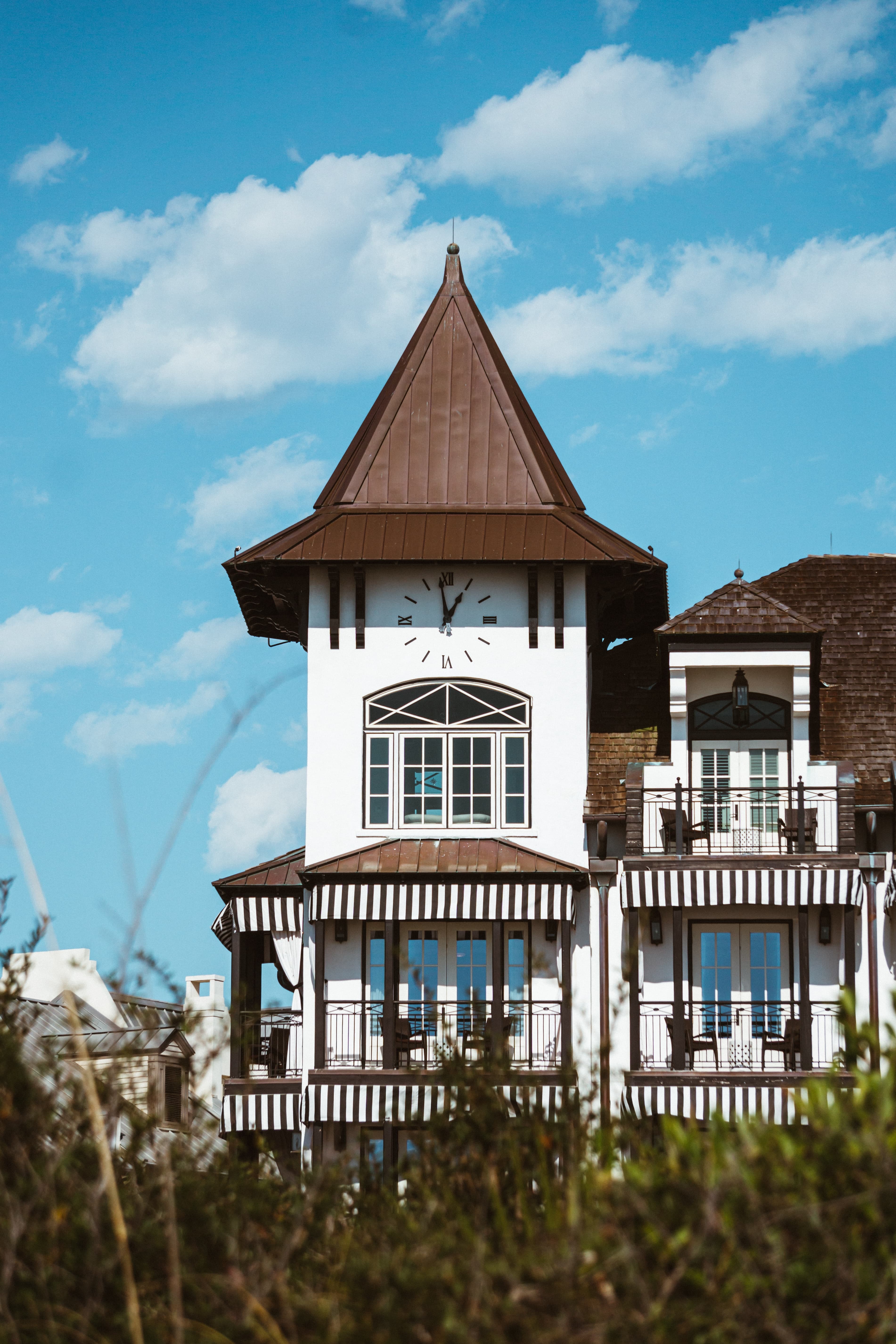 white building with brown roof during daytime