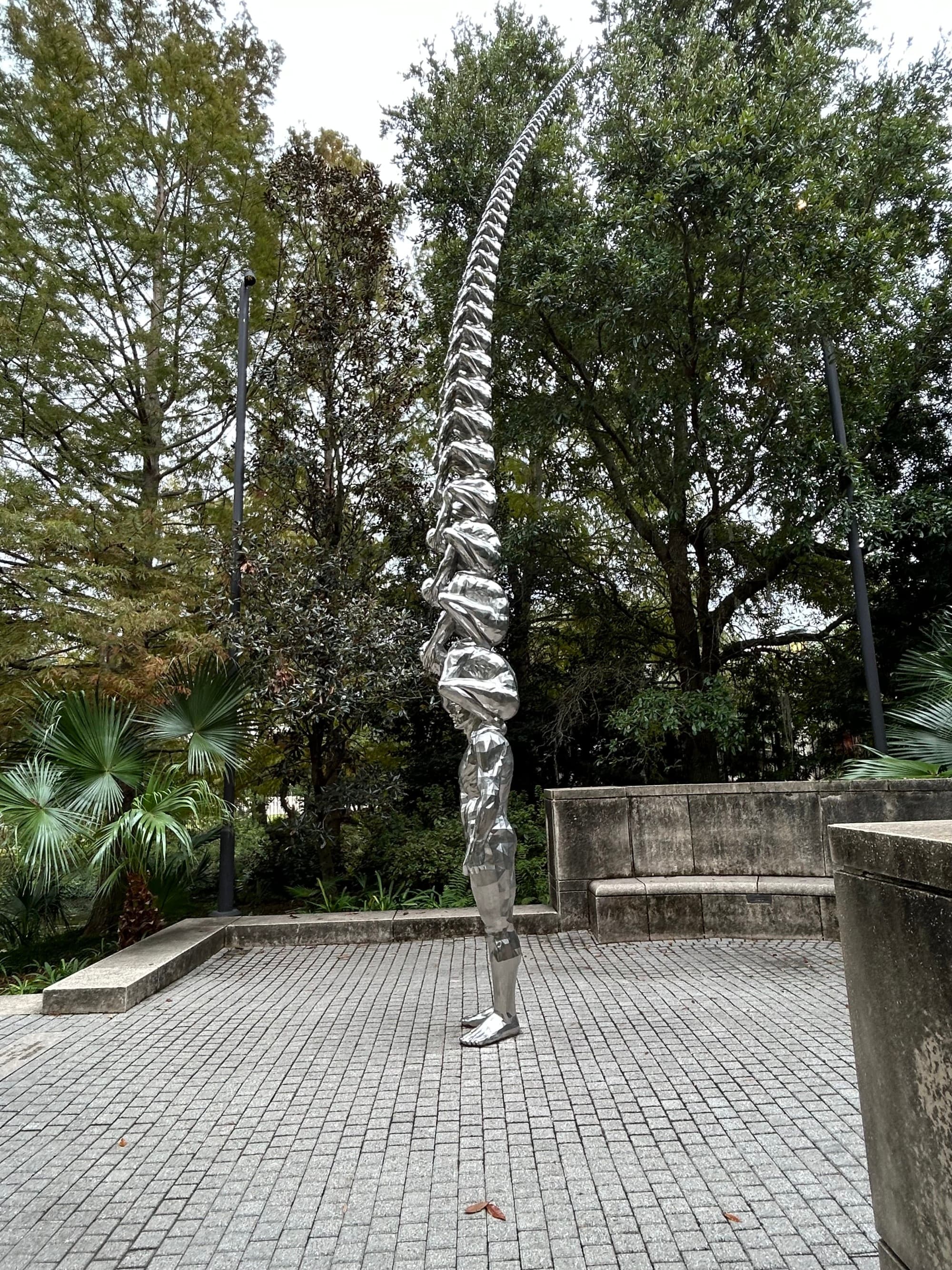 A silver statue during daytime in New Orleans.