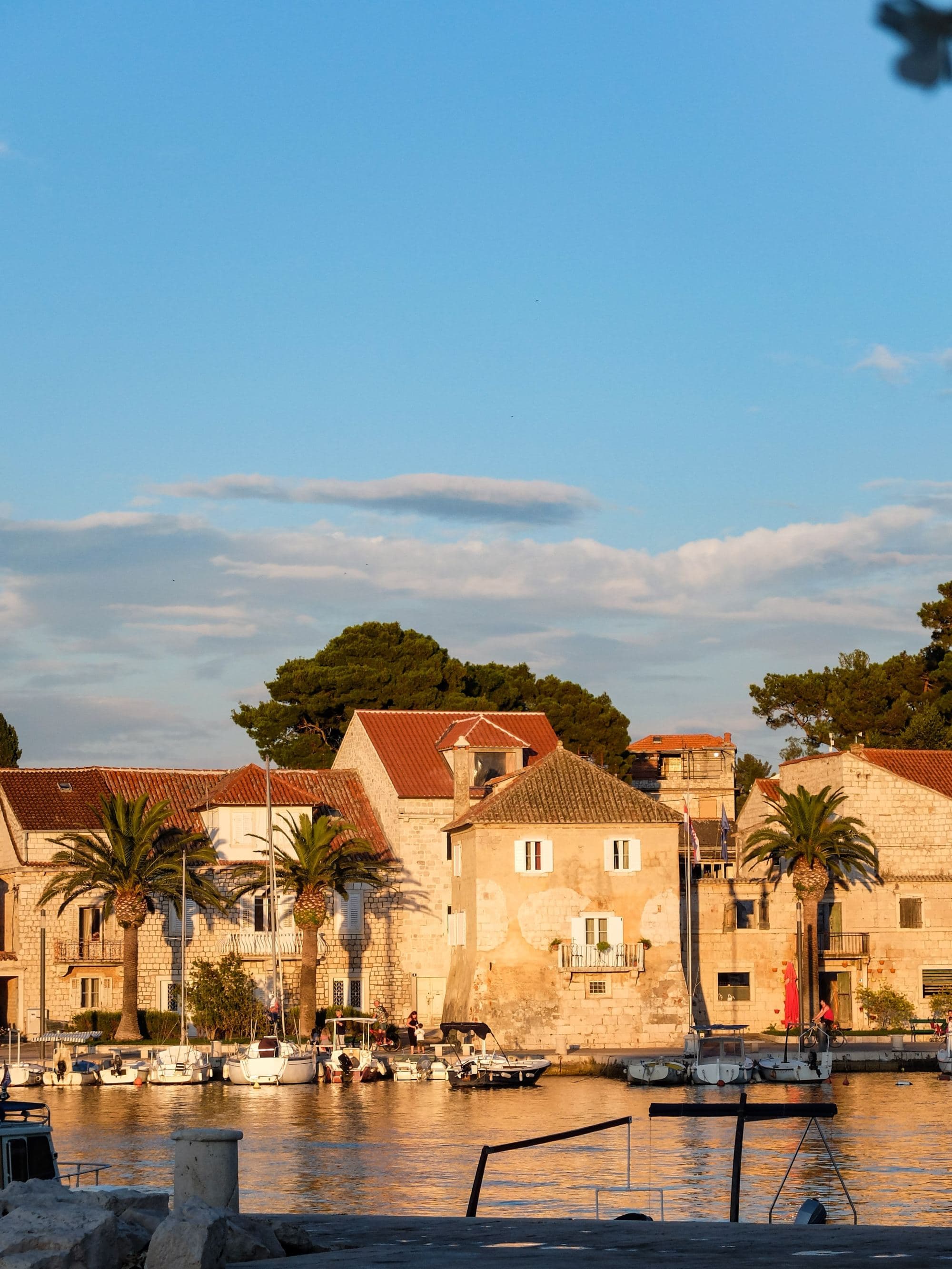 buildings with golden hour sun and harbor