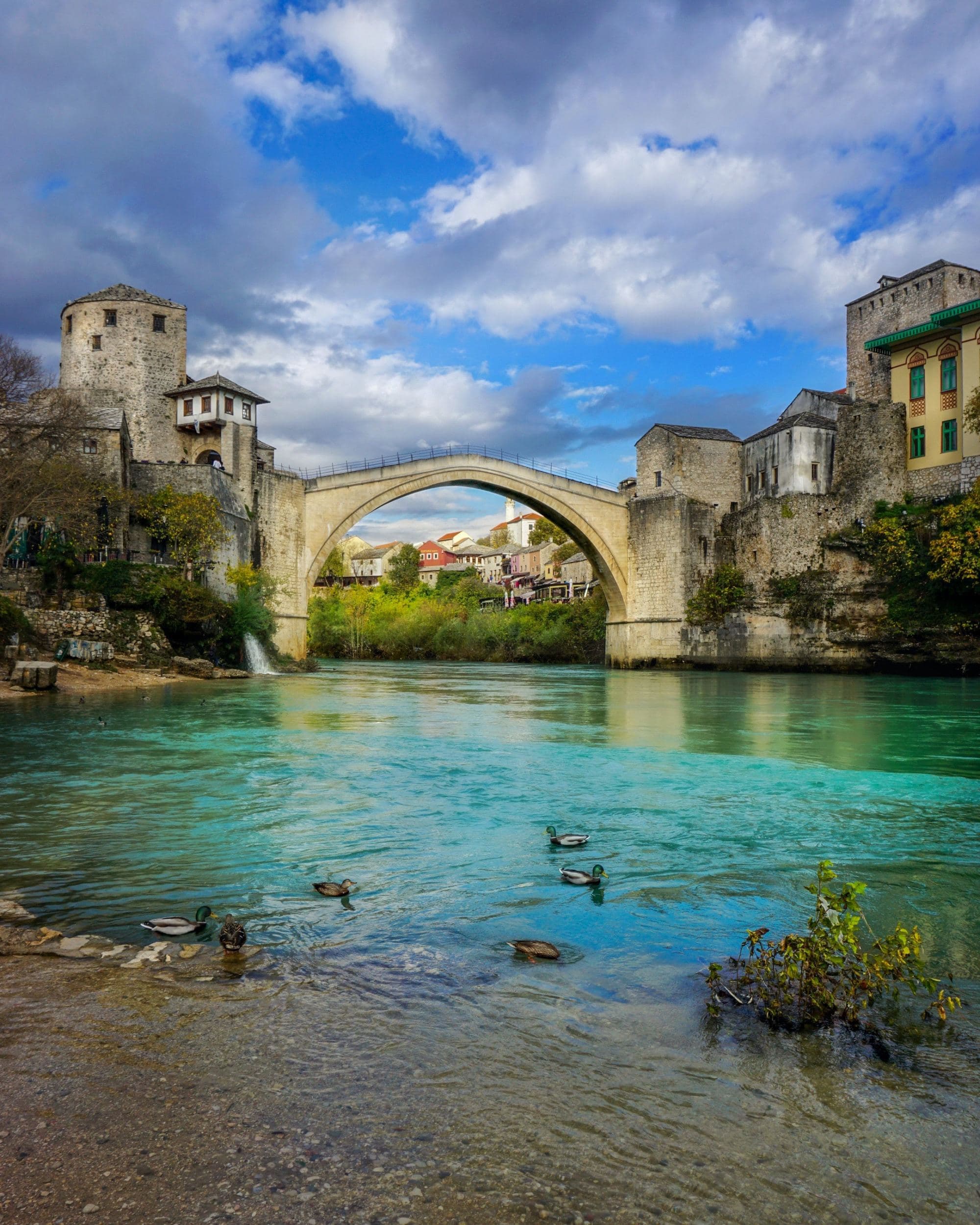 An old bridge over a river.