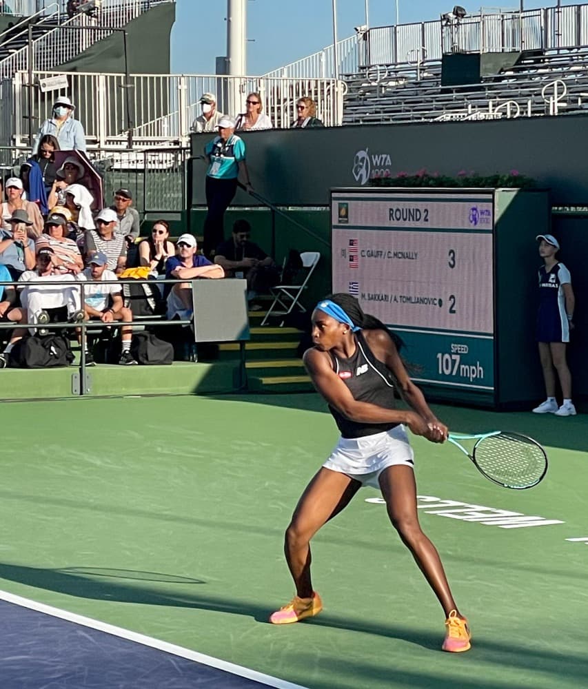 A tennis player on a court during daytime