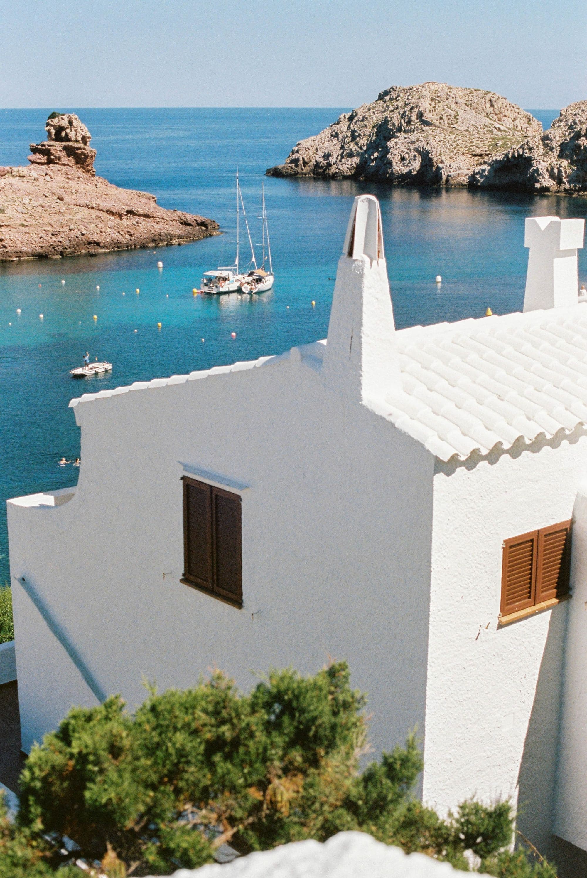 White and brown building near the sea