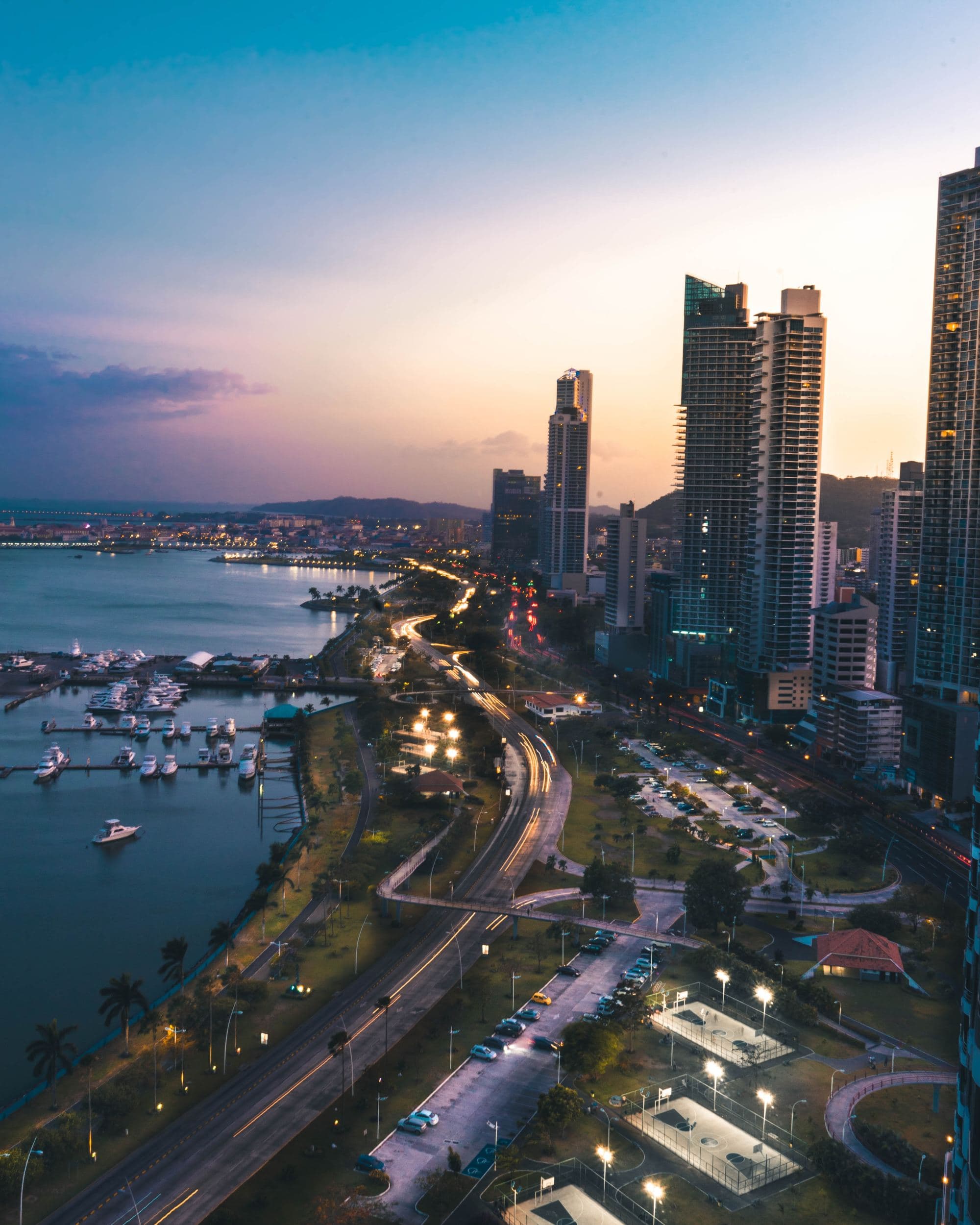 An aerial view of the city with high rise building at sunrise.