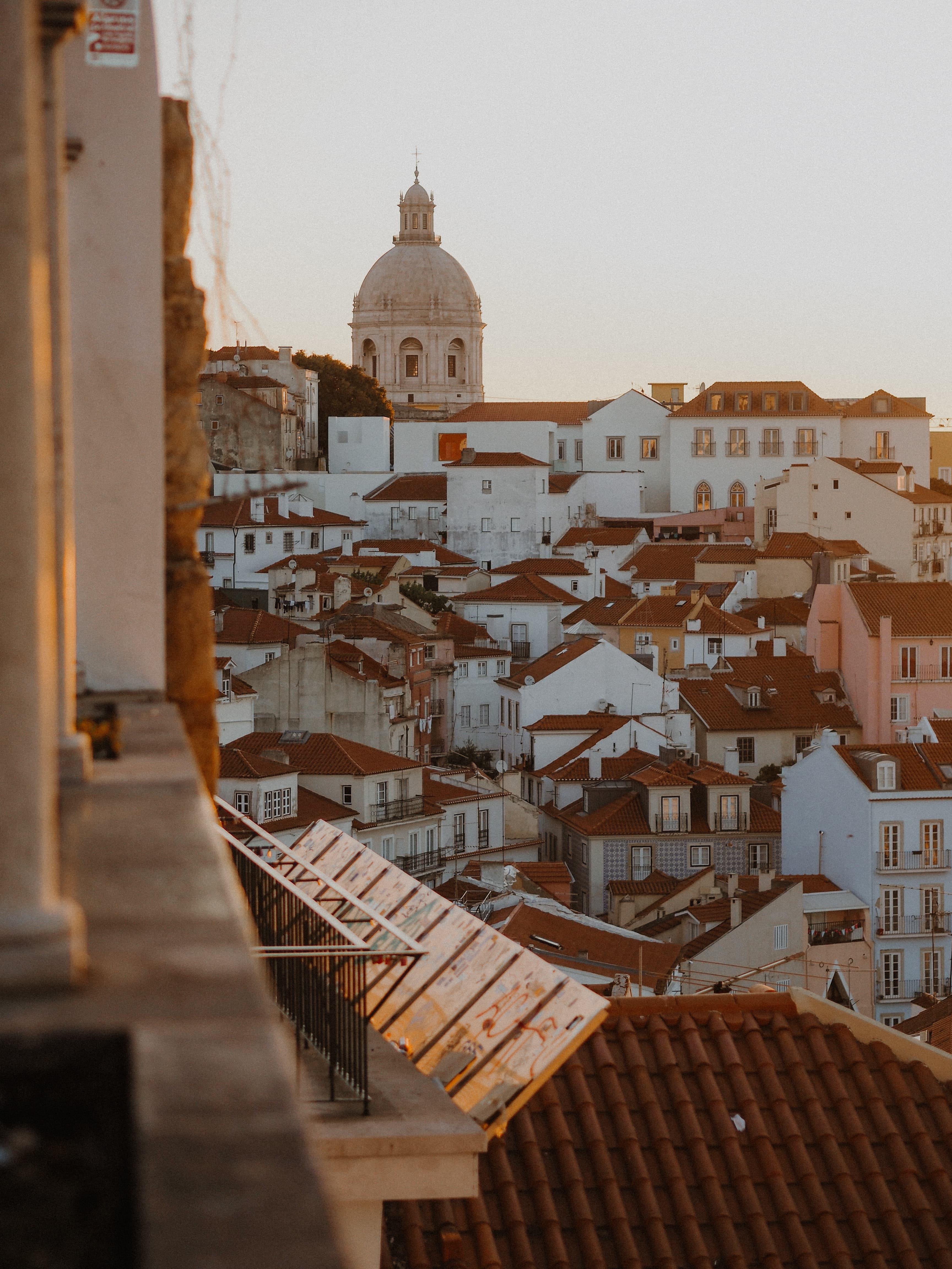 White and red houses during sunset