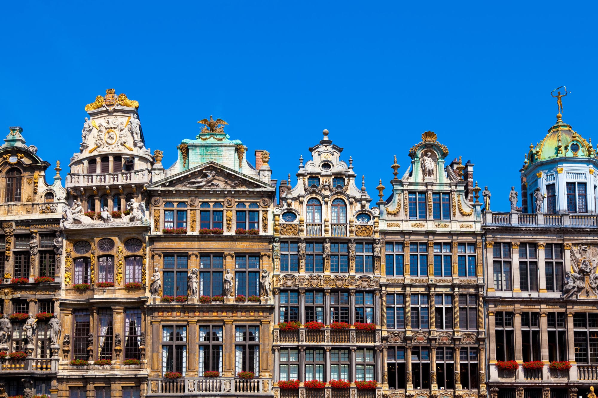 colorful European buildings against a blue sky