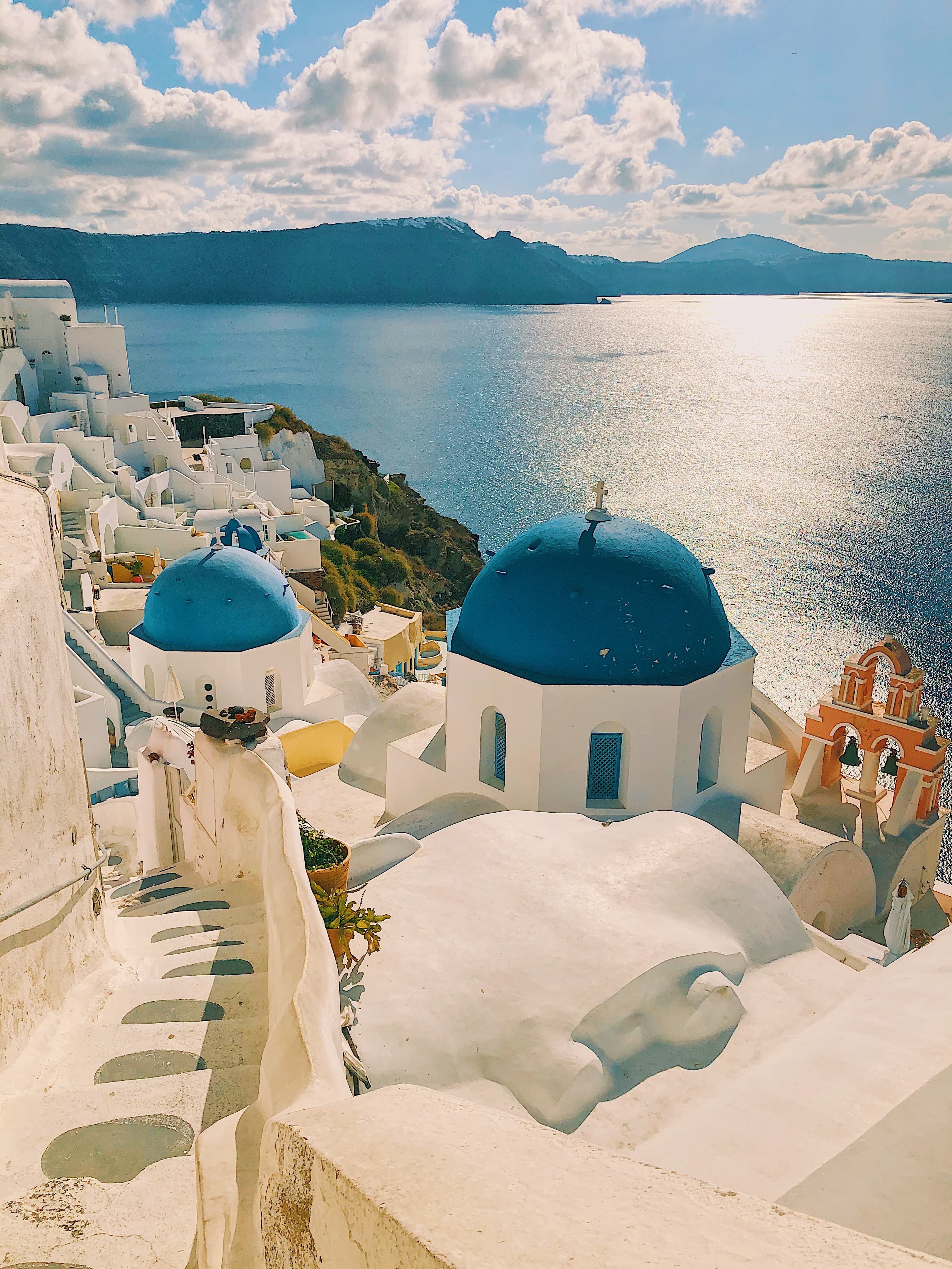 White and blue concrete architecture in Santorini near the sea.