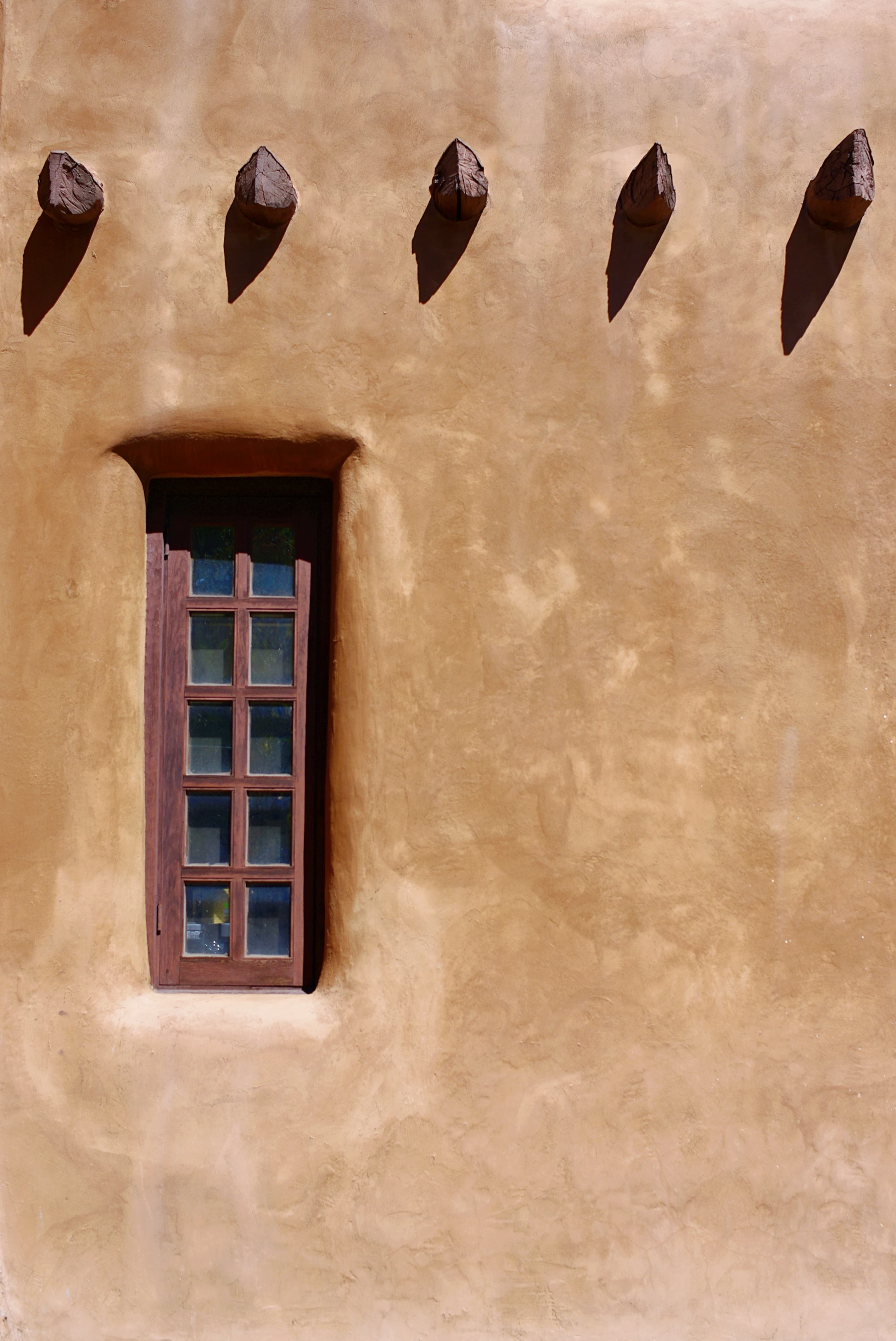 Burnt orange adobe wall in Santa Fe.