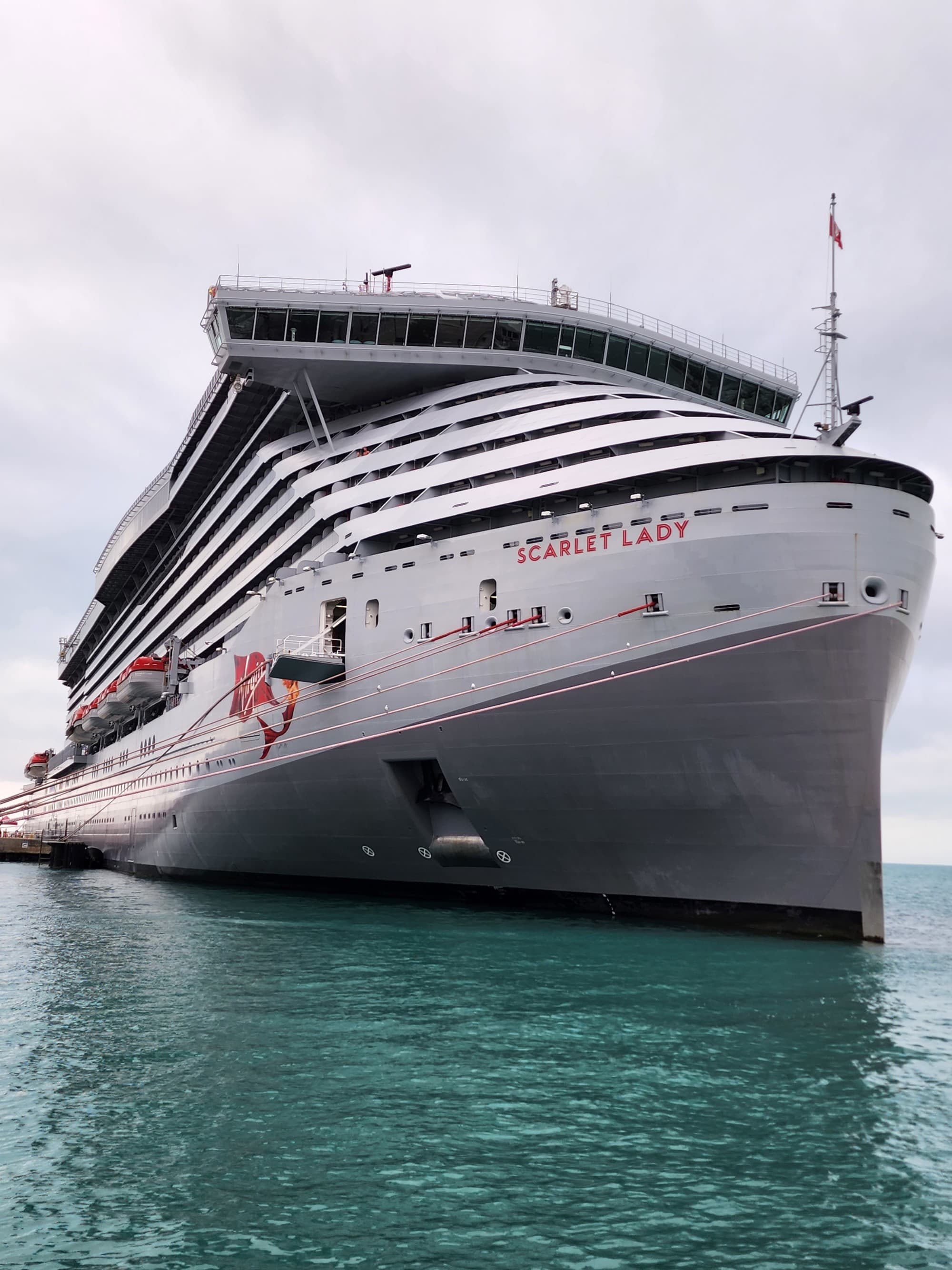 A low angled shot of a cruise ship on the water during daytime.