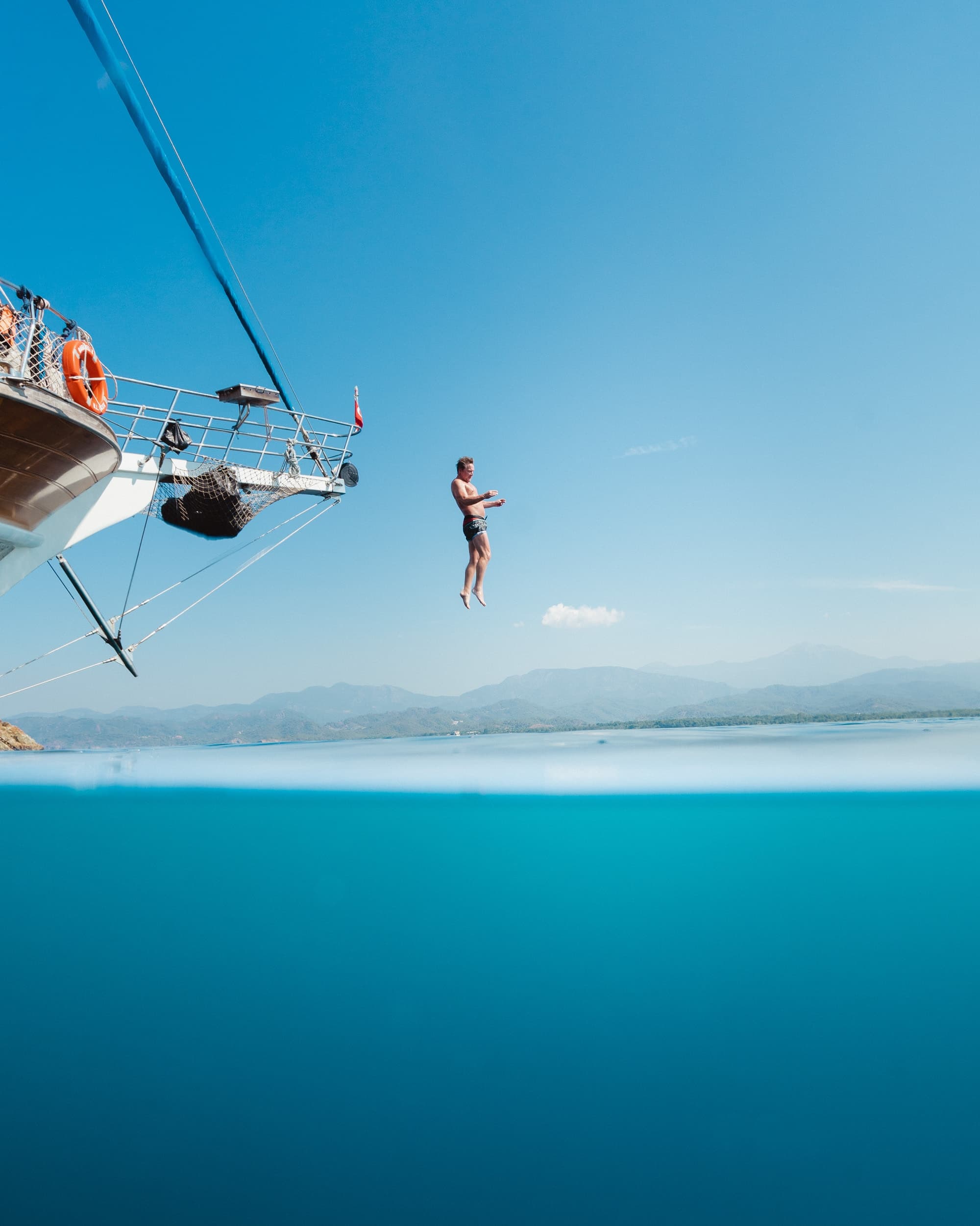 Man jumping off a ship's bow