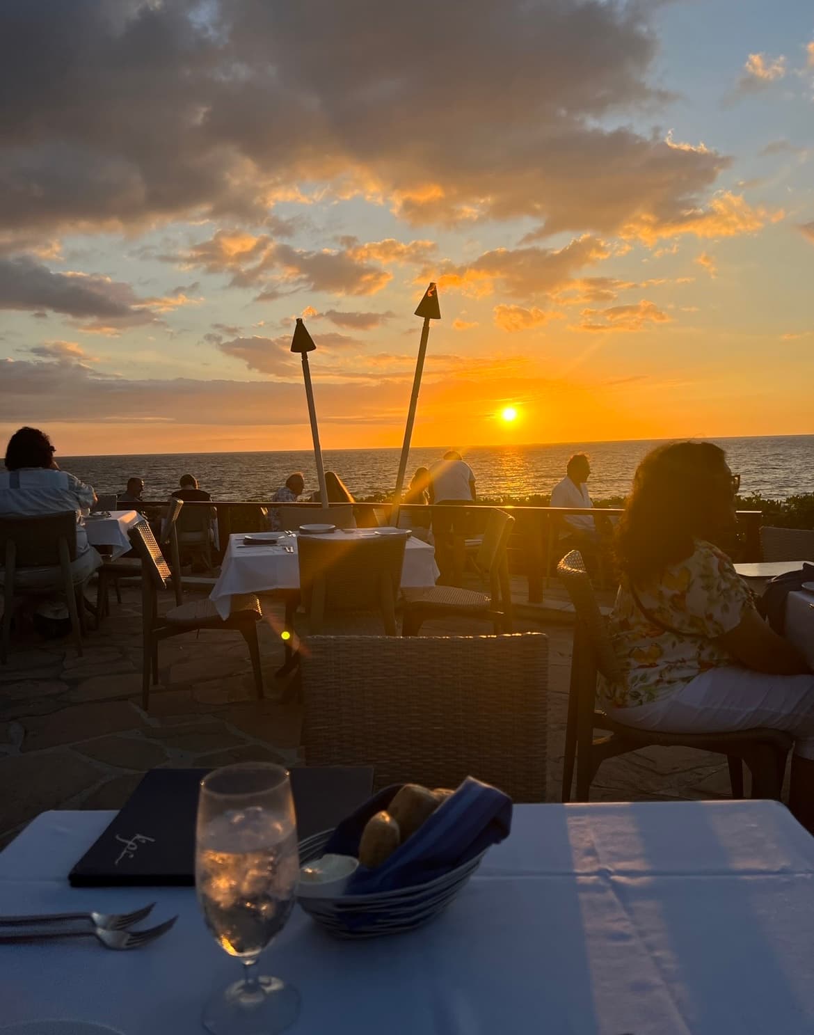 bread basket on white table cloth during sunset